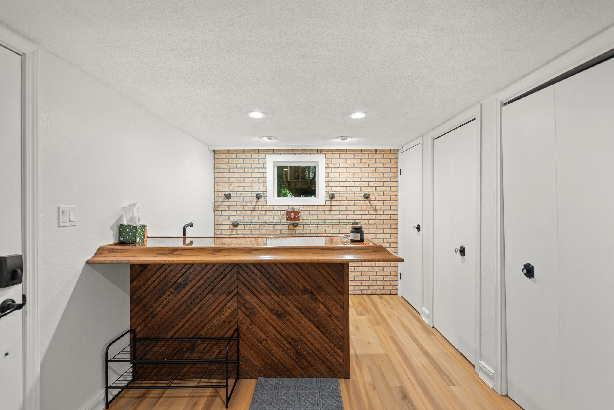 Wet bar near the rec room keeps refreshments within easy reach.
