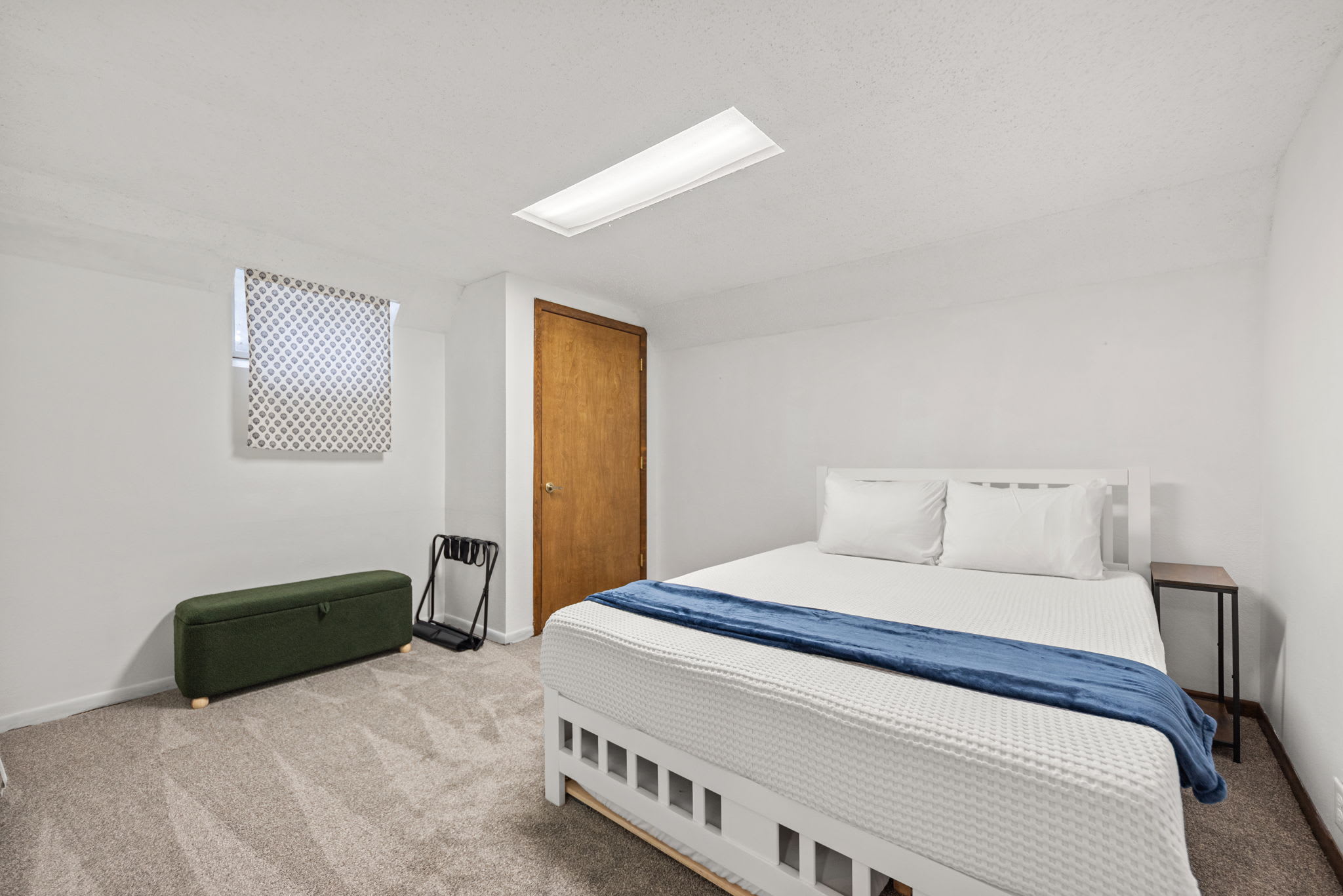Bedroom 5 is located on the main level with a queen-size and single trundle bed.