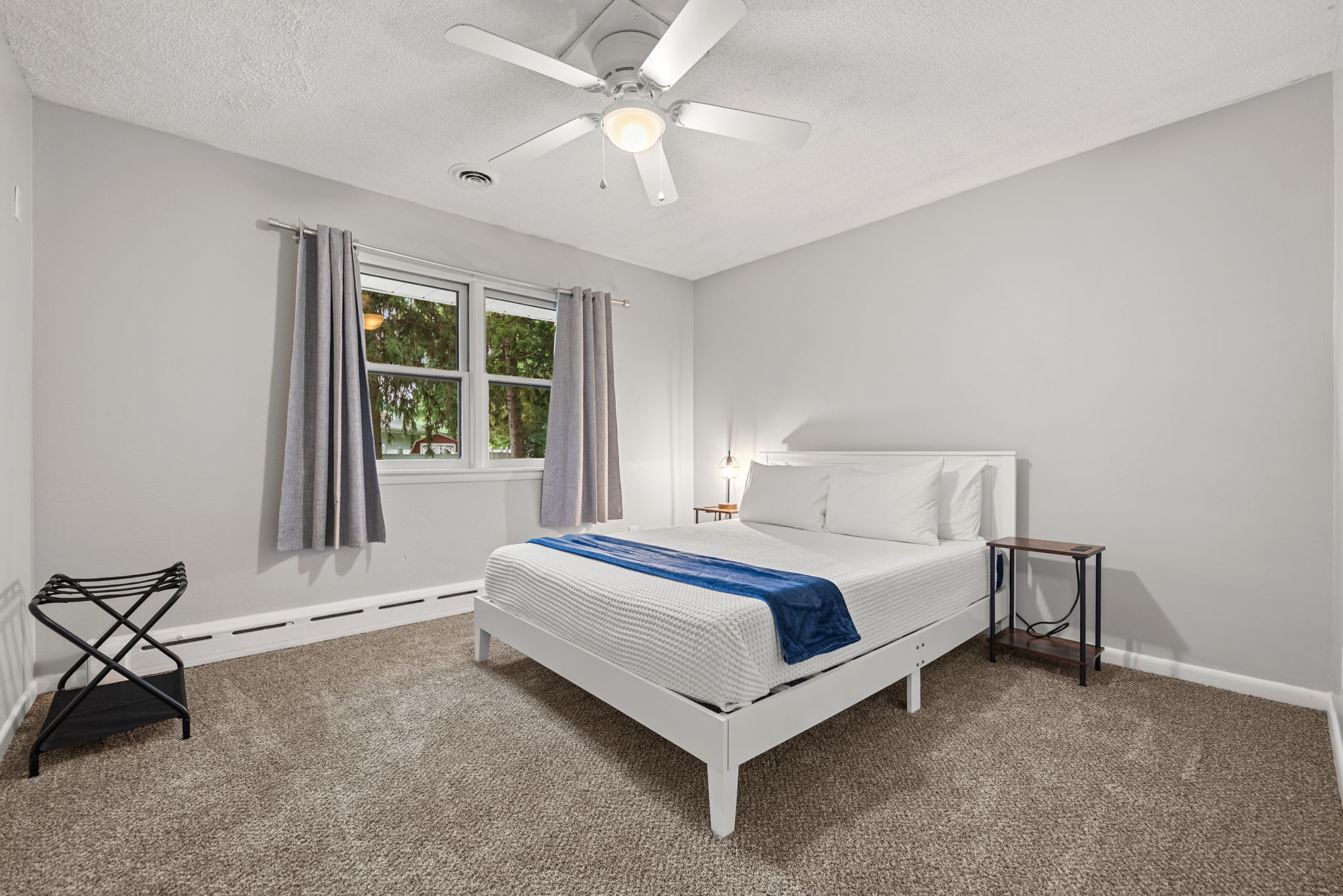 Bedroom 3 is located on the upper level with queen-sized bed.