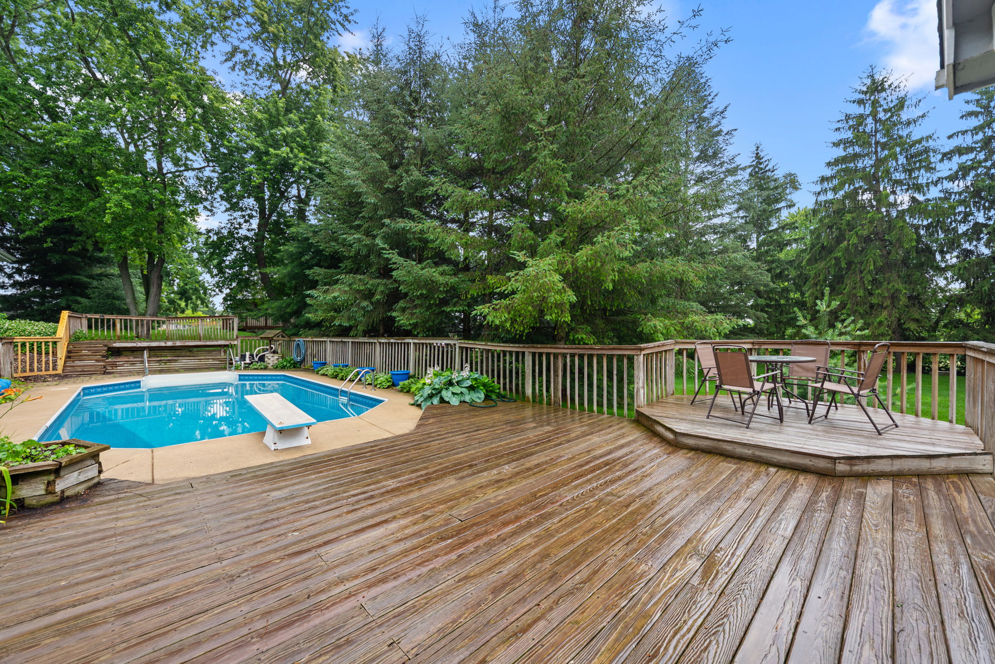 Pool deck with outdoor seating keeps everyone close to the action.