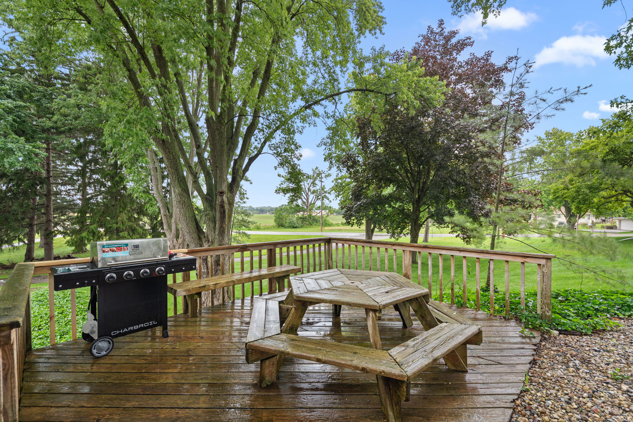 Backyard deck offers a convenient space for outdoor dining.
