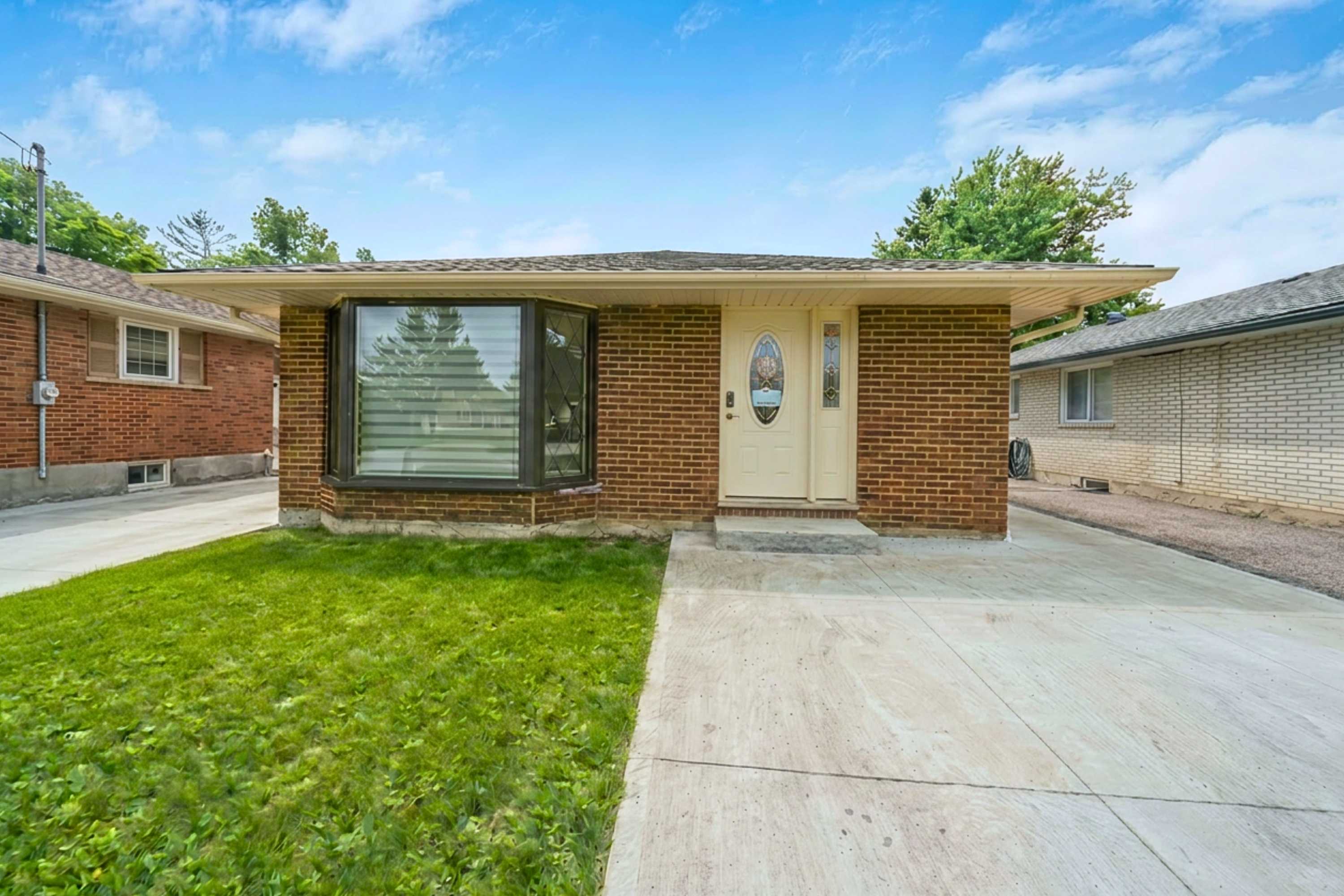 Private entrance with driveway parking beside the apartment