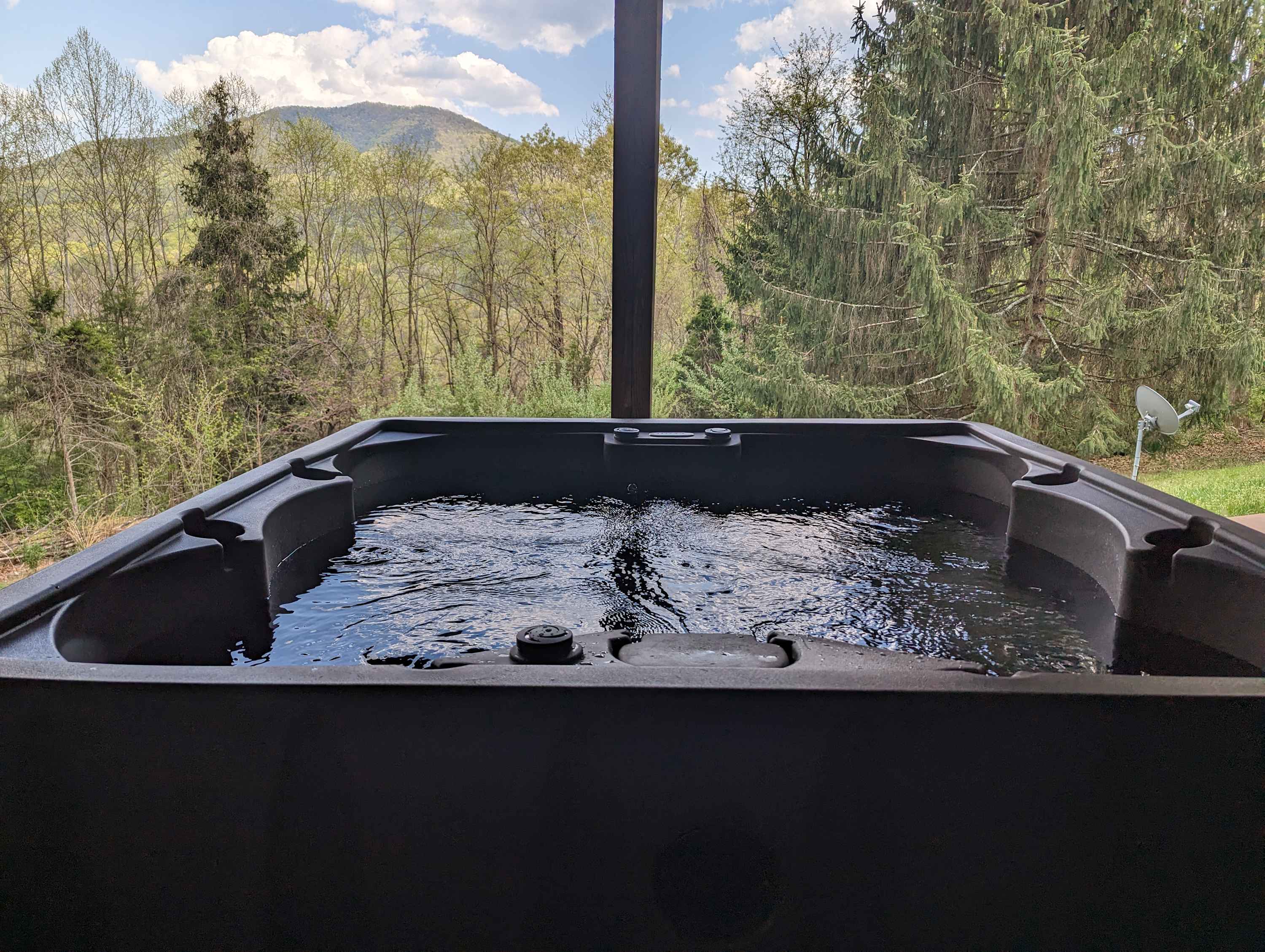 Unwind in the hot tub and enjoy the mountain views