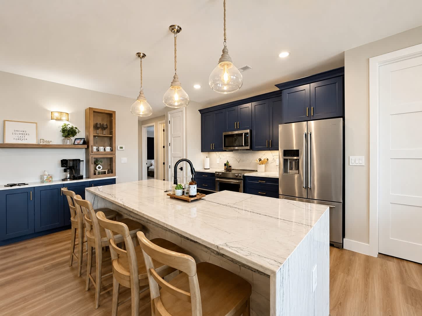 The chic, open kitchen offers ample space & all the comforts of home​