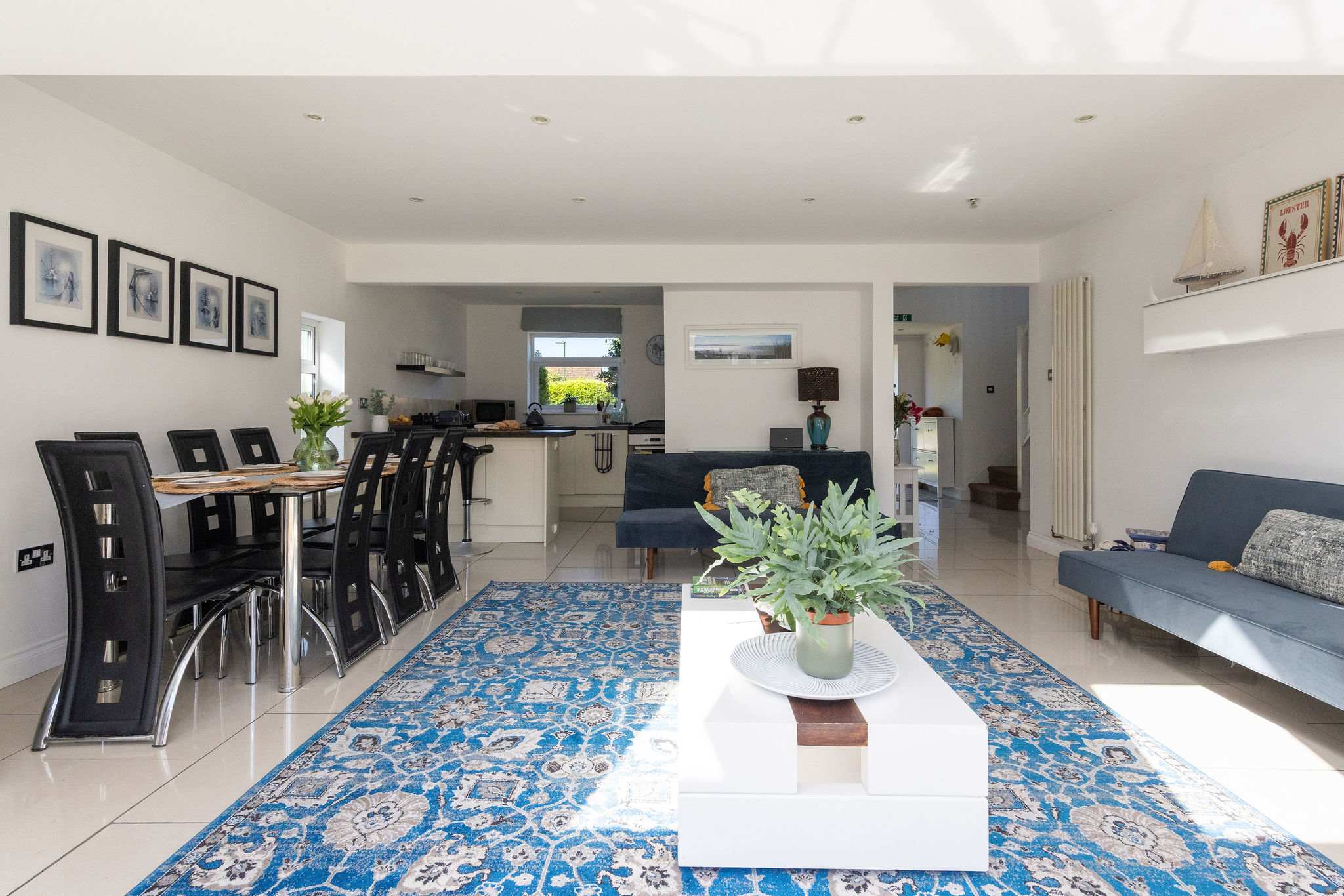 Gather for meals in the spacious open plan living area of this family getaway.