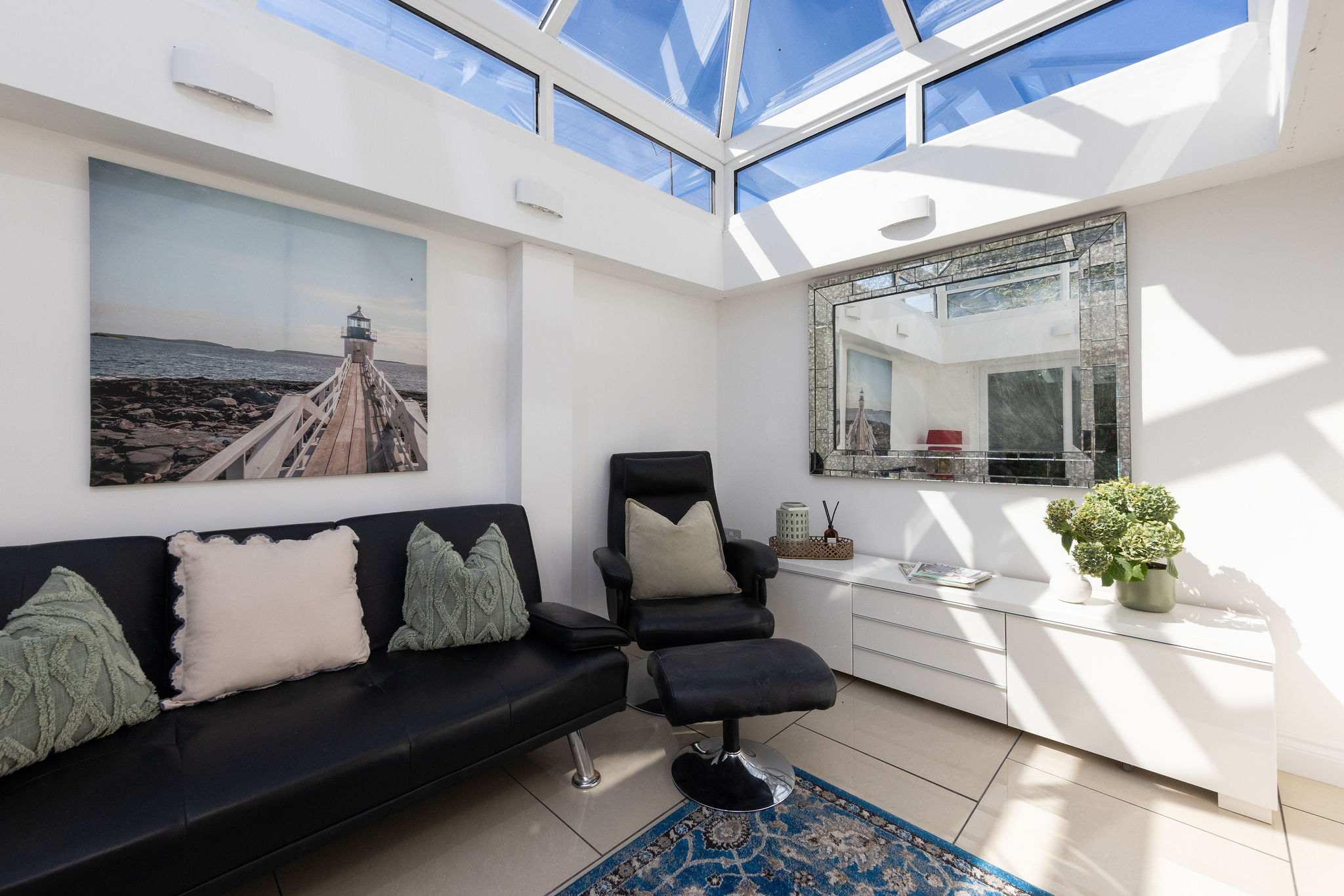 Unwind in the beautifully bright conservatory of this coastal retreat during your relaxing holiday.