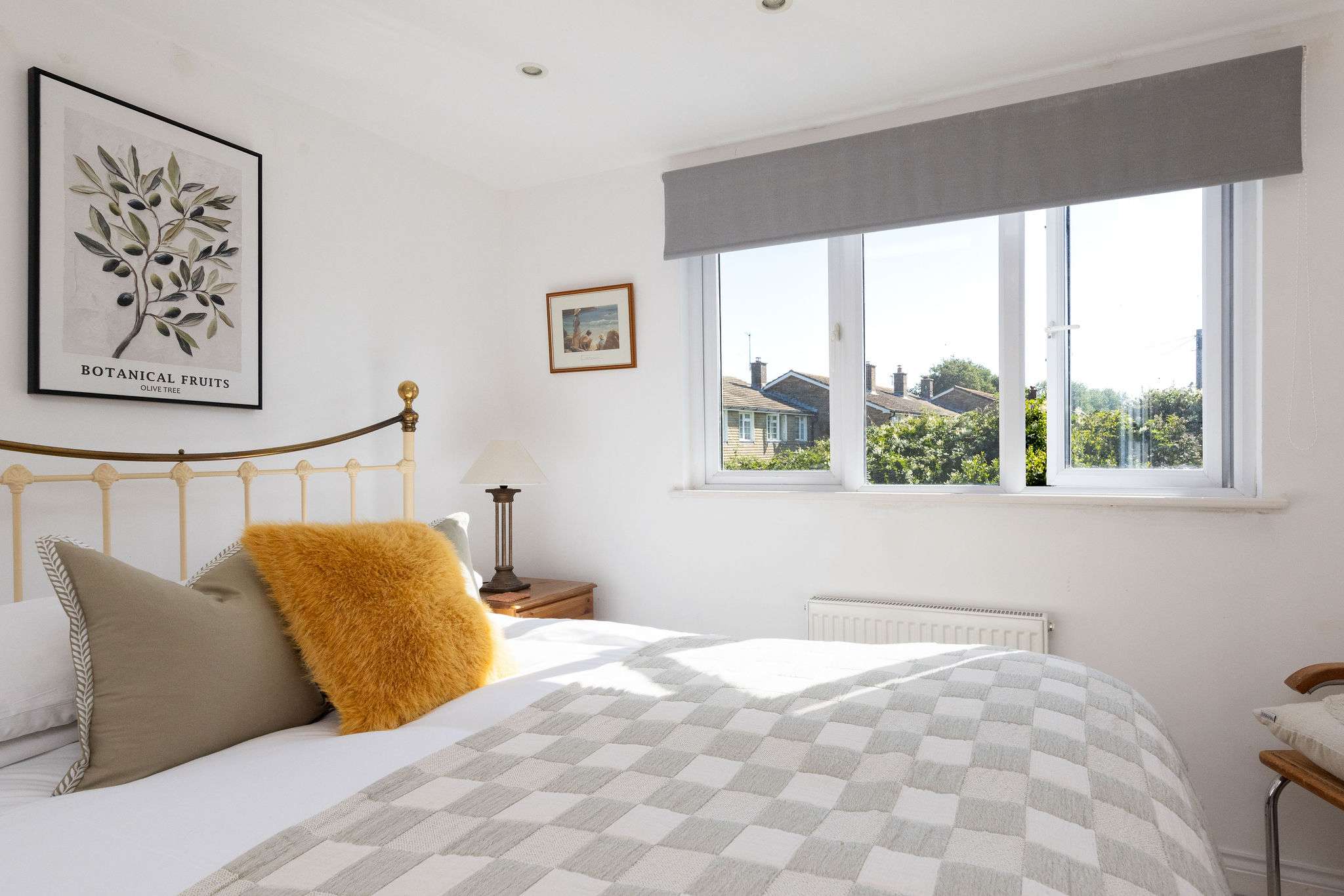 Unwind in this bright and cosy bedroom offering pleasant views at our holiday home.