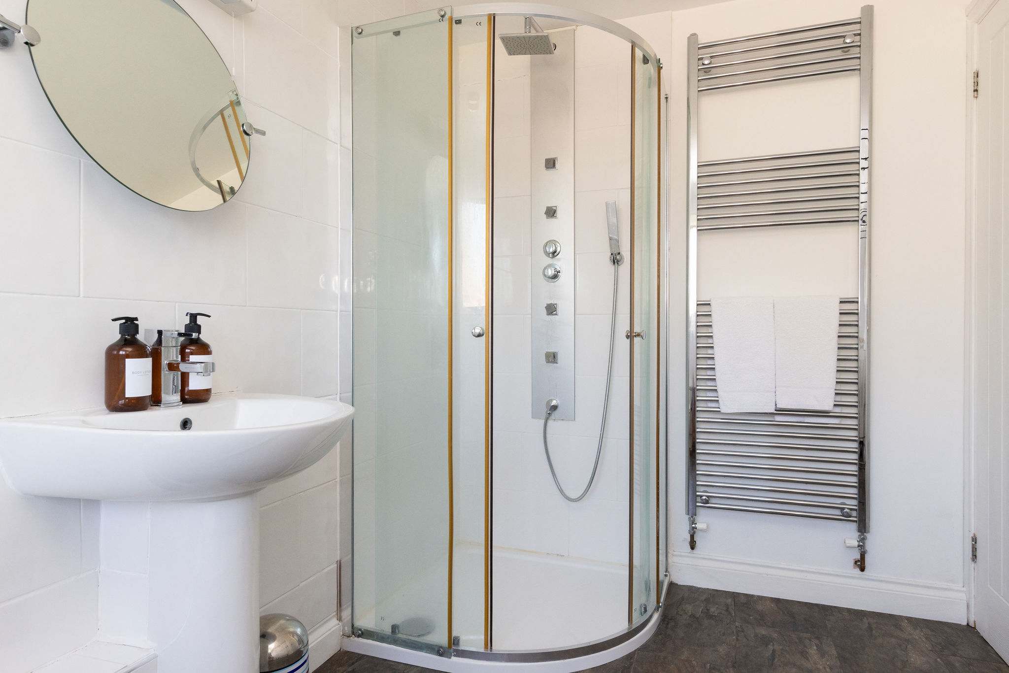 Start your day refreshed using the modern corner shower in this spacious holiday home.