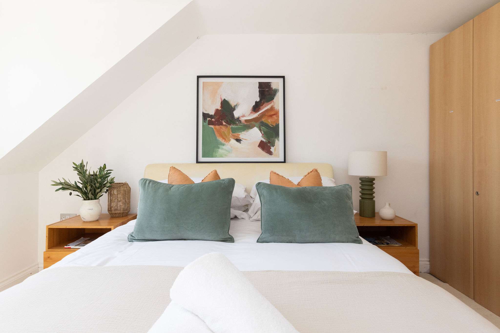 Enjoy a peaceful night of sleep in the plush bed of our modern retreat.
