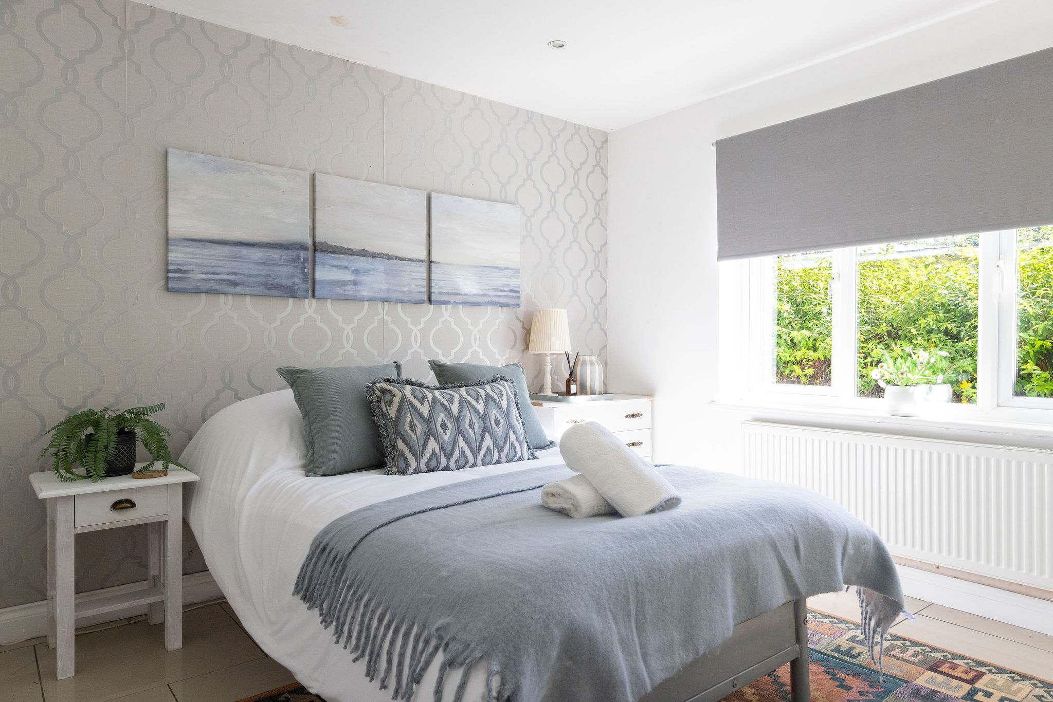 Settle into this beautifully decorated bedroom with coastal touches during your relaxing family holiday.