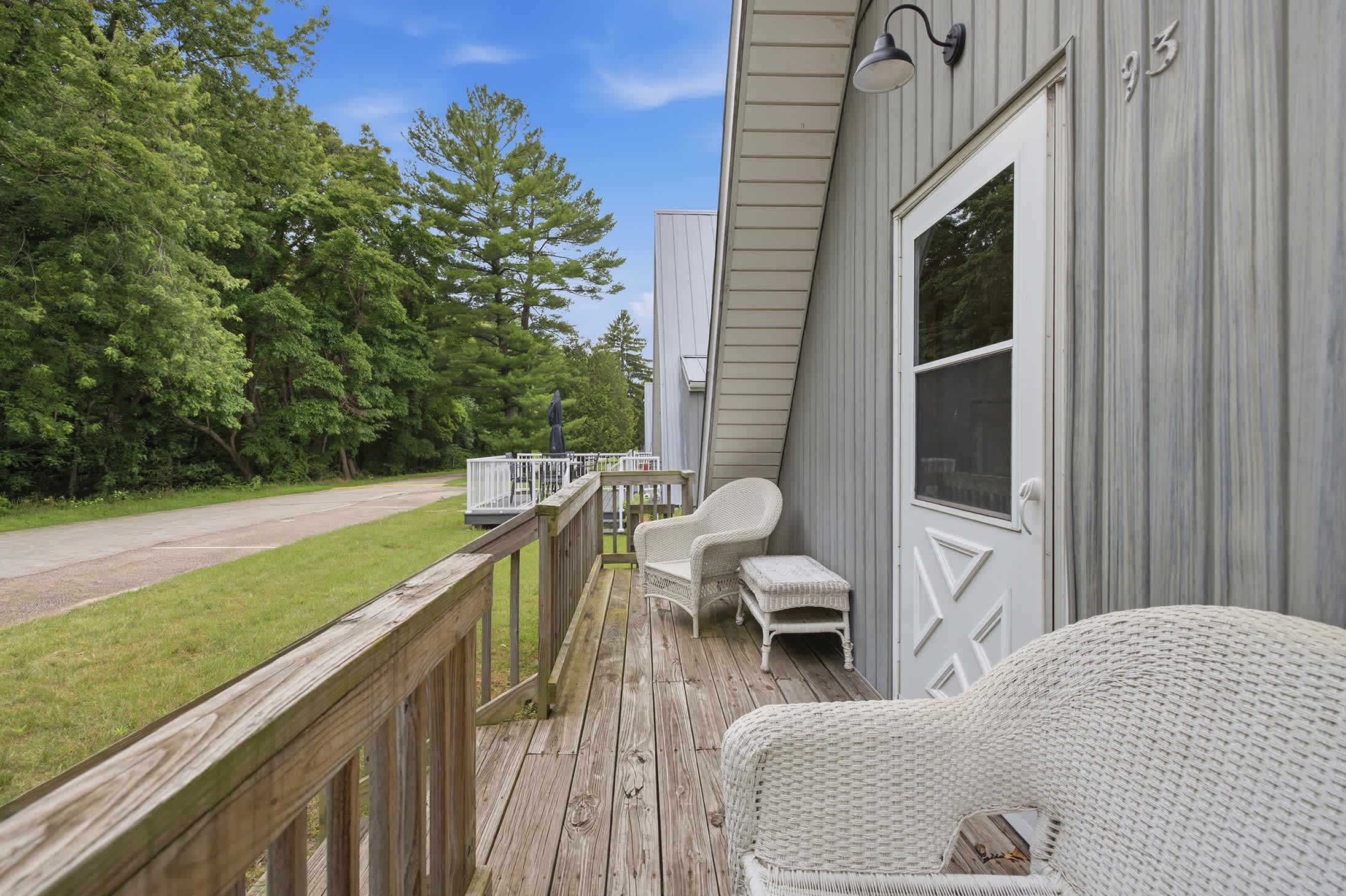 Enjoy fresh air and peaceful mornings from Chalet #93's front porch.