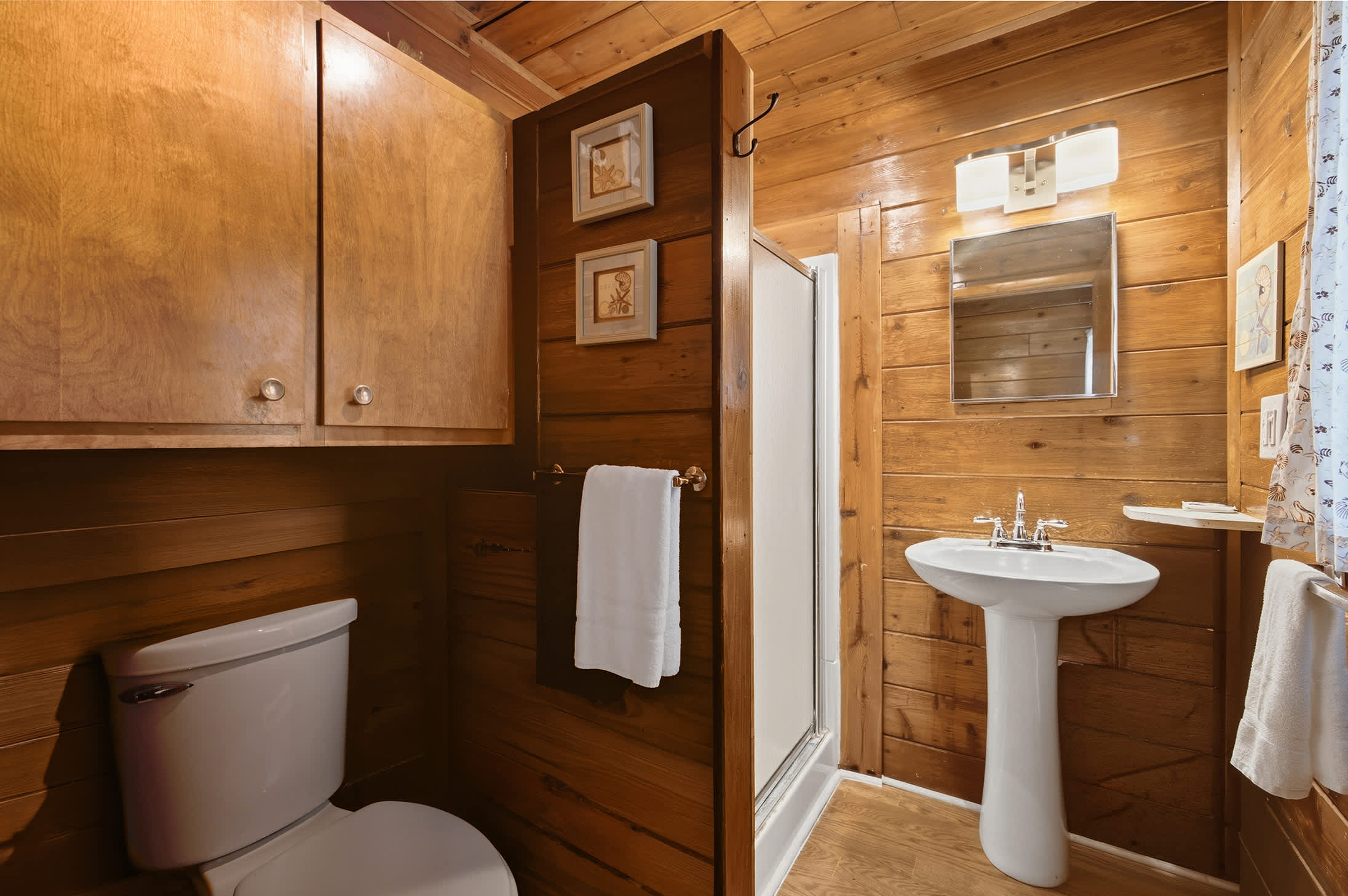 Convenient full bath with a walk-in shower on the main level.