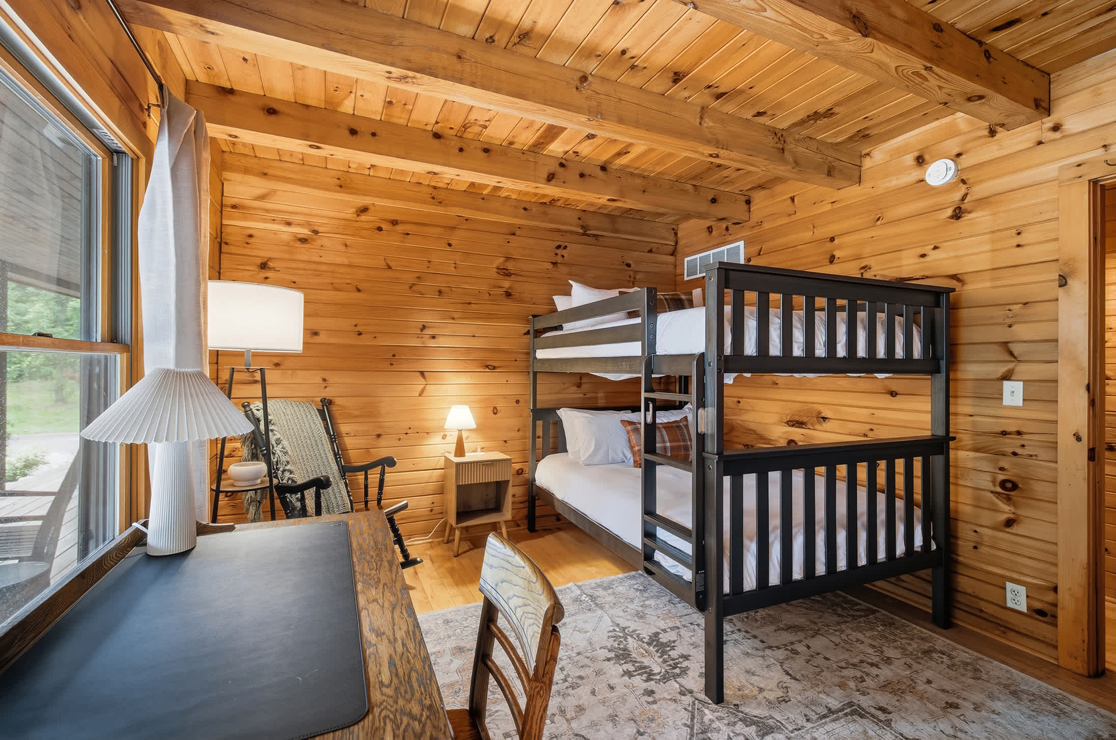 Our warm wood bunk room is perfect for shared nights.