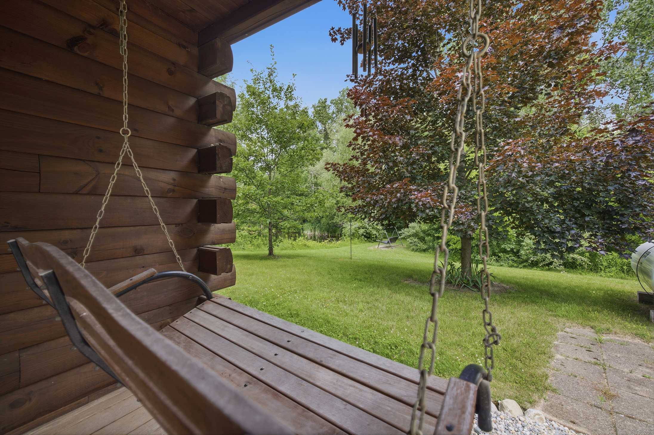 A gentle sway, dappled shade, and the whole green yard to yourself.