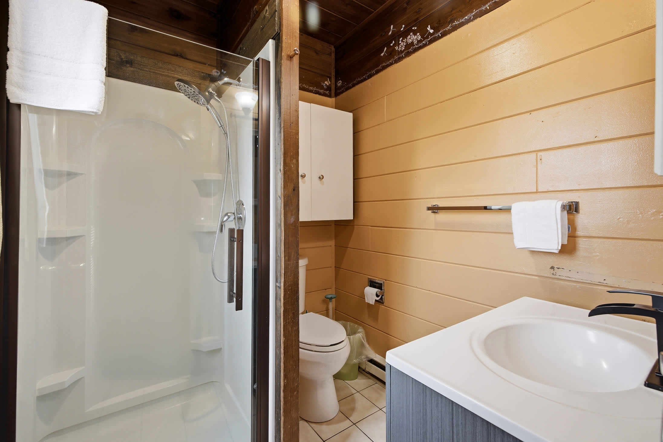 Main-floor full bathroom with a walk-in shower for added convenience.