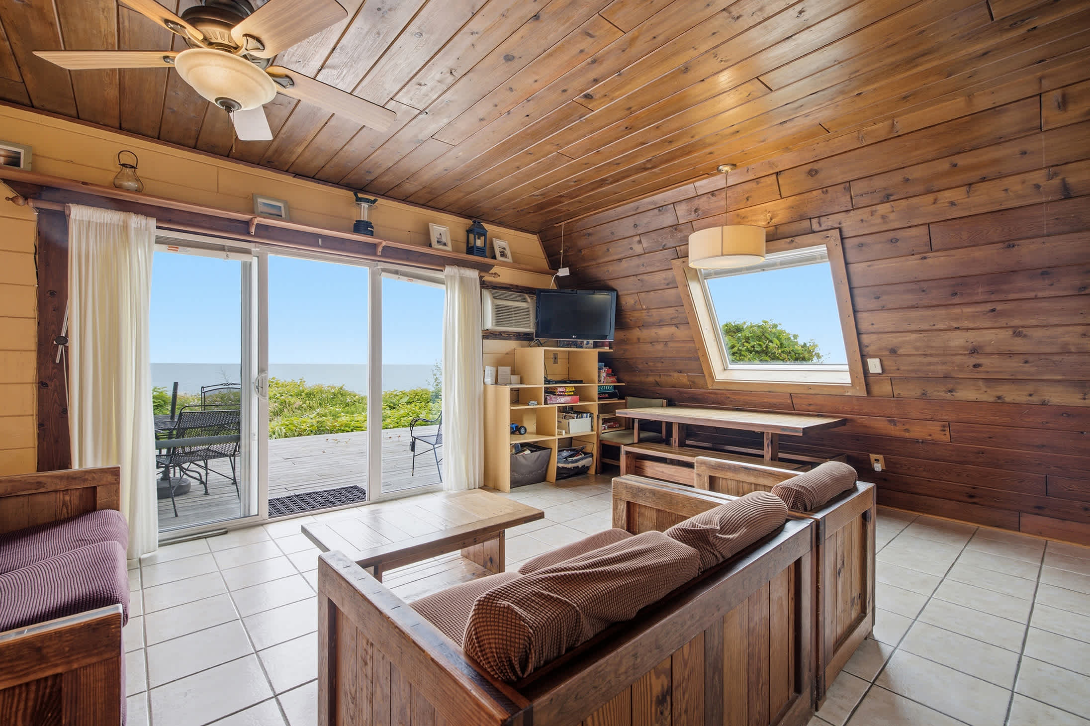 Chalet #8's living room opens to a deck with stunning Lake Michigan views.