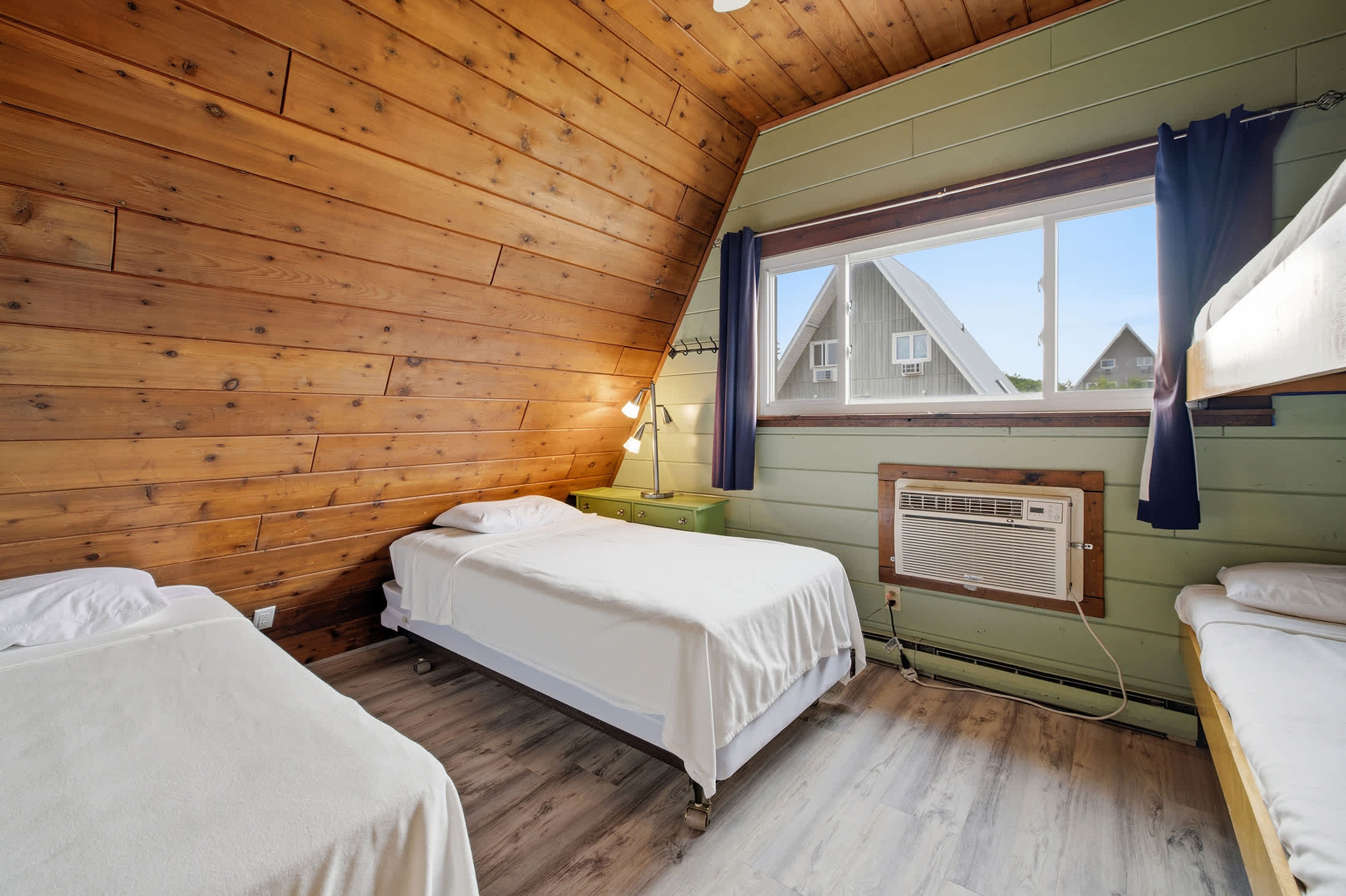 Bedroom 2 is on the 2nd floor and has 2 single beds and single bunk bed.