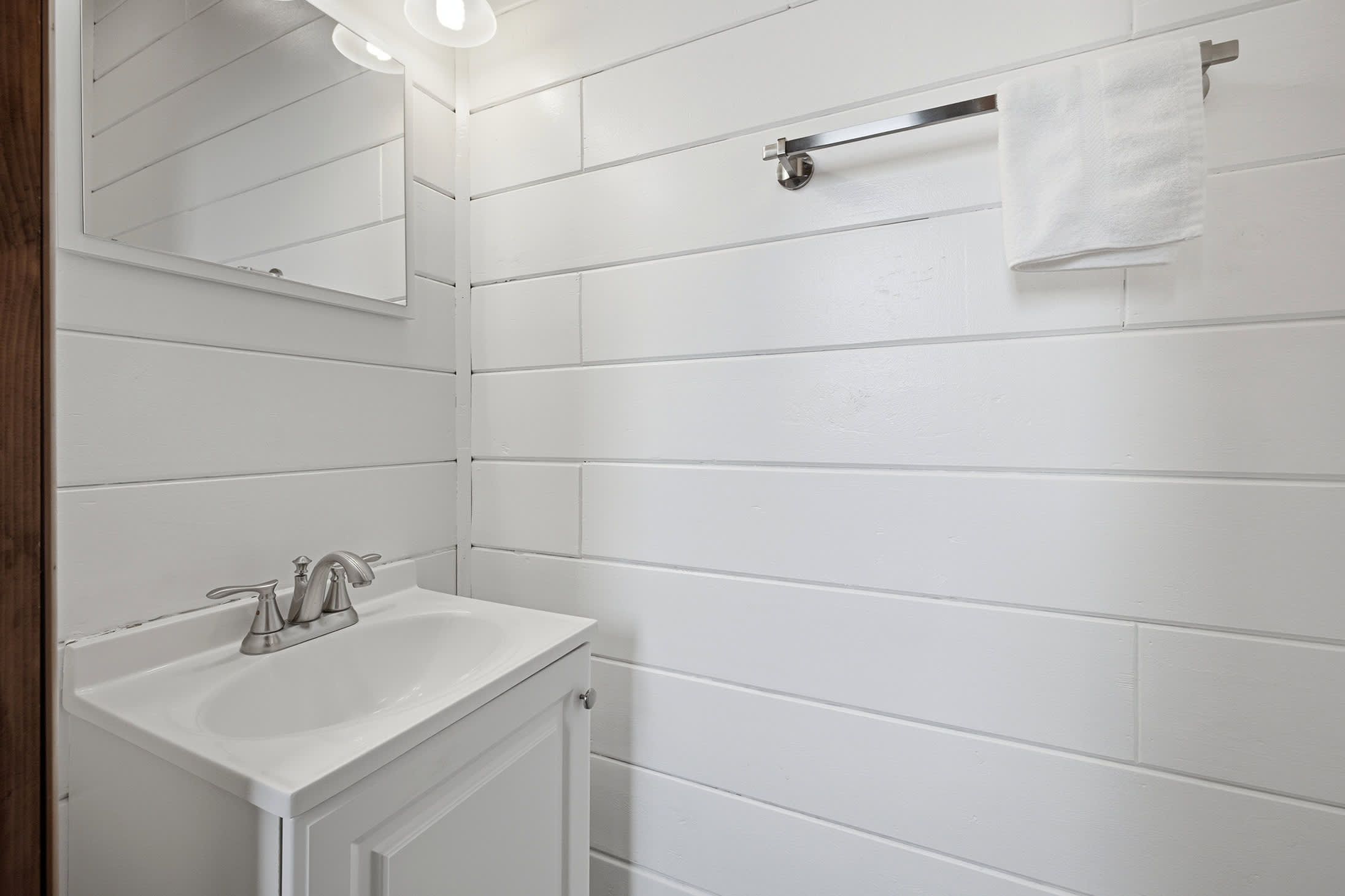A convenient second-floor half bath keeps everyone moving with ease.