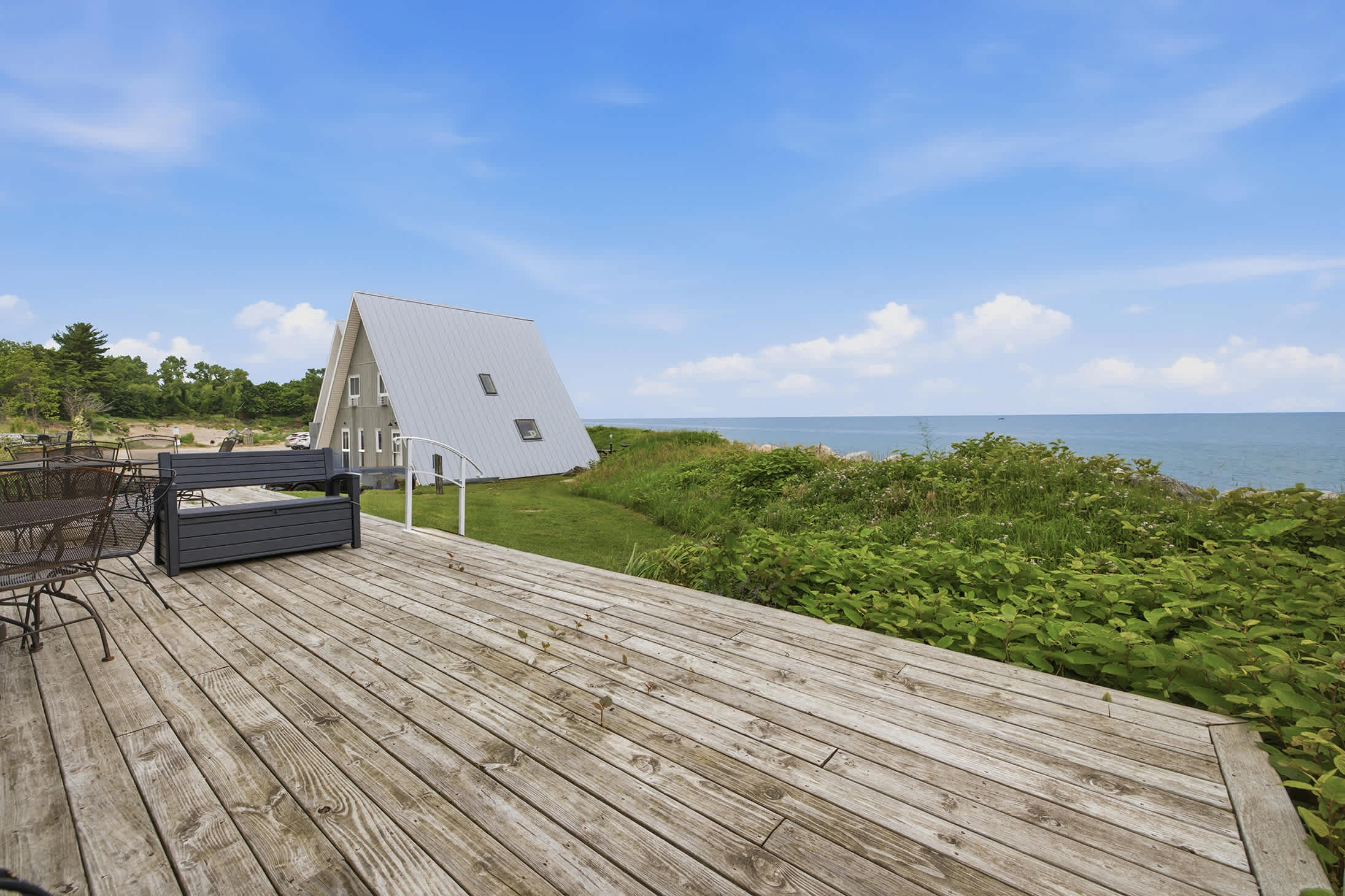 Enjoy panoramic Lake Michigan views from your dedicated deck seating area.