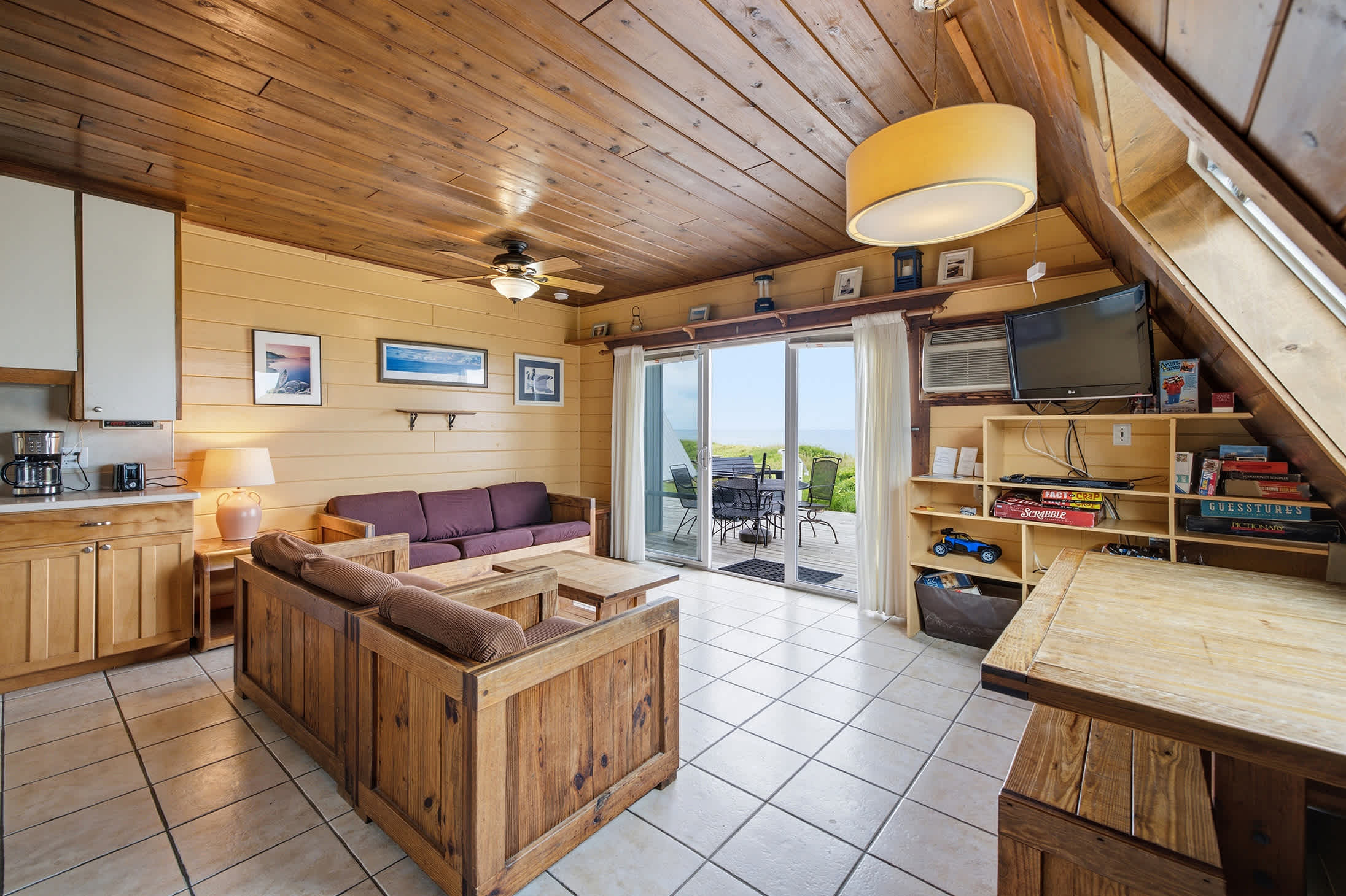Open living area flows seamlessly to the lakefront deck and views.