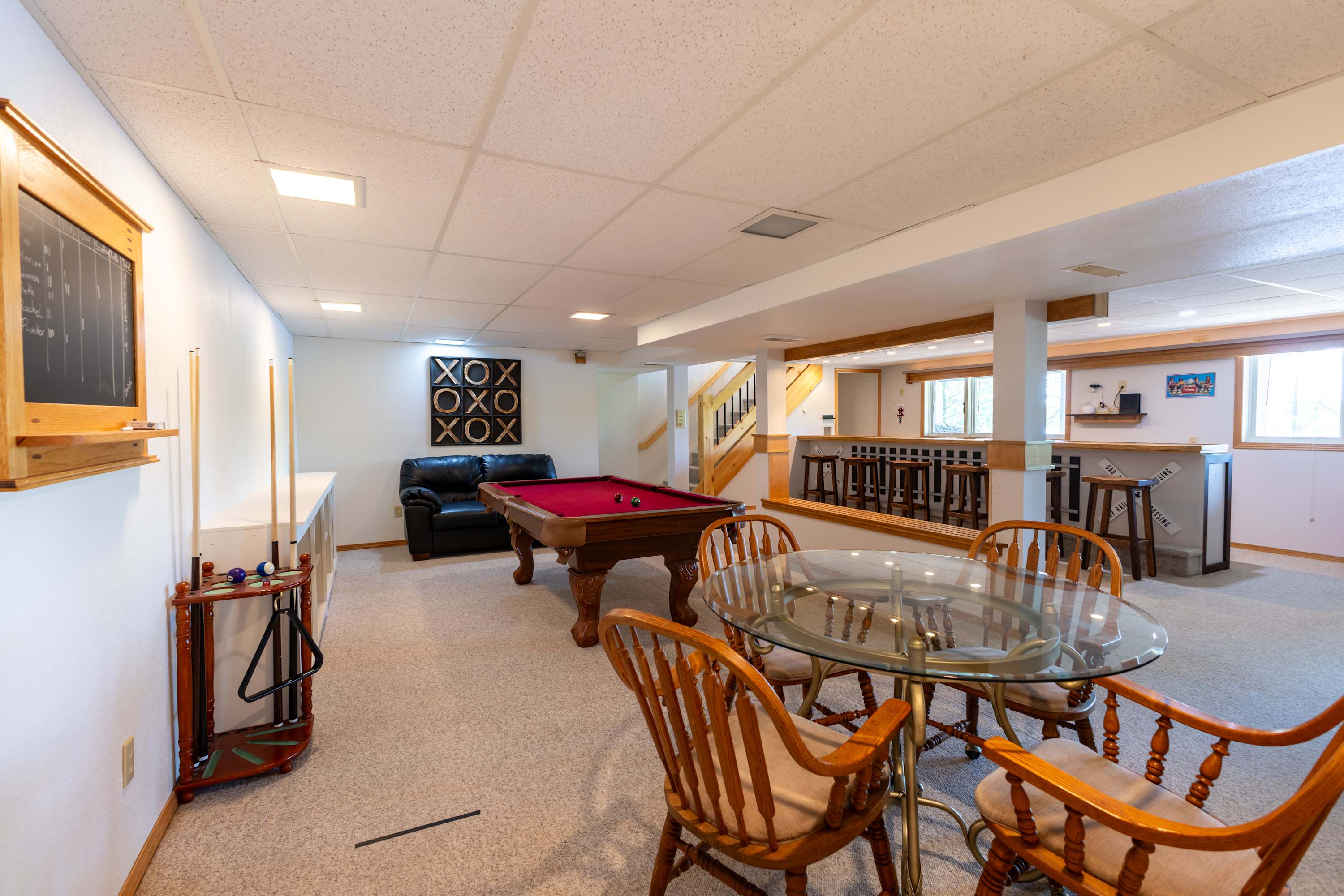 Basement Game room. complete with railroad themed bar, Pool Table, game table, and full bathroom. Walk out basement allows for easy access after a day on the lake