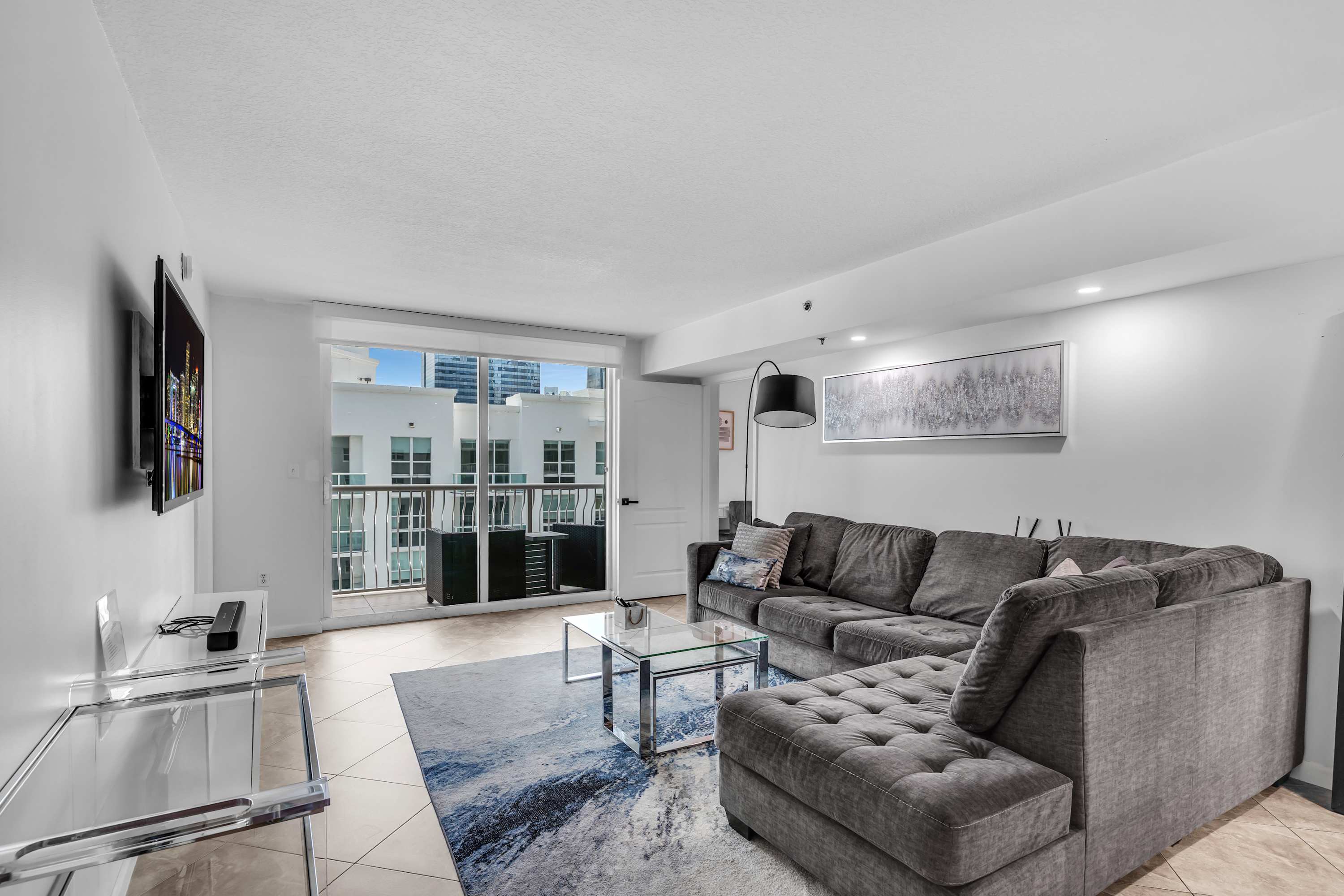 Curl up in the chic living room & enjoy a movie night at home​