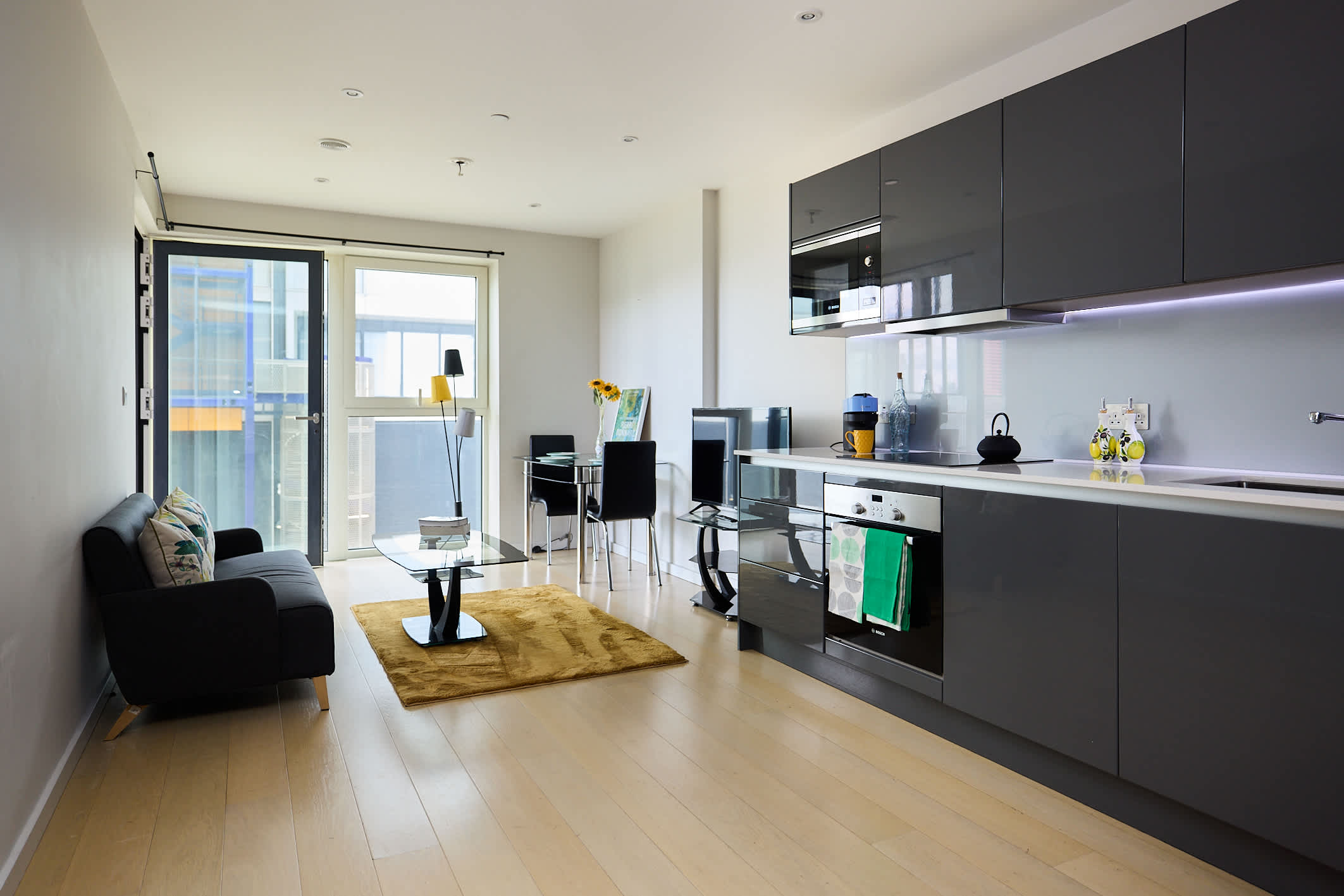 Minimalist Grey Design & Sunlit Glass in Flat 201, Cassia Point, Glasshouse Gardens, E20 1HR London, United Kingdom E20 1HR - Property image 2 - VivreStays