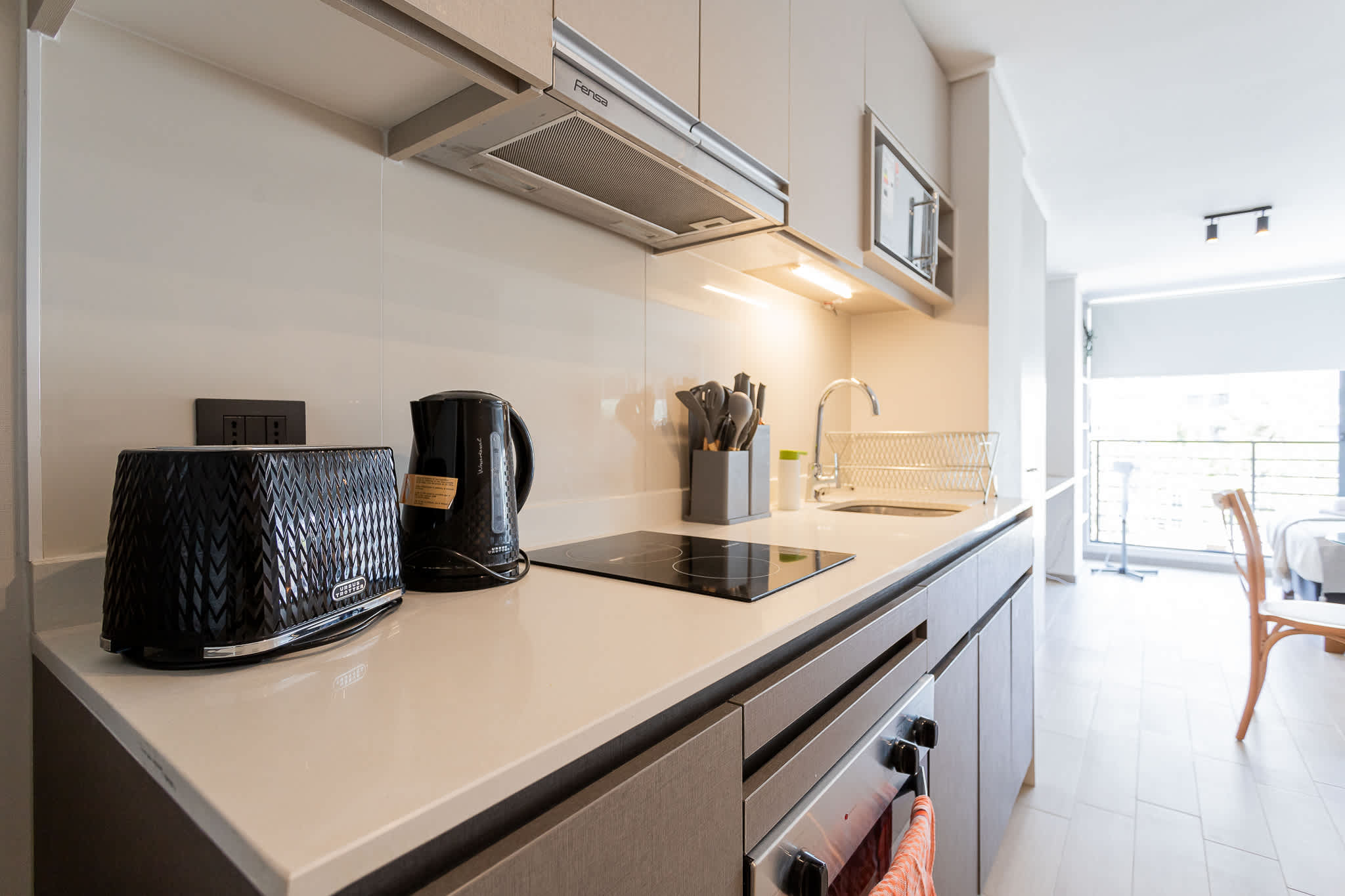 Sleek and modern kitchen with all essentials for a comfortable stay in the heart of the city.