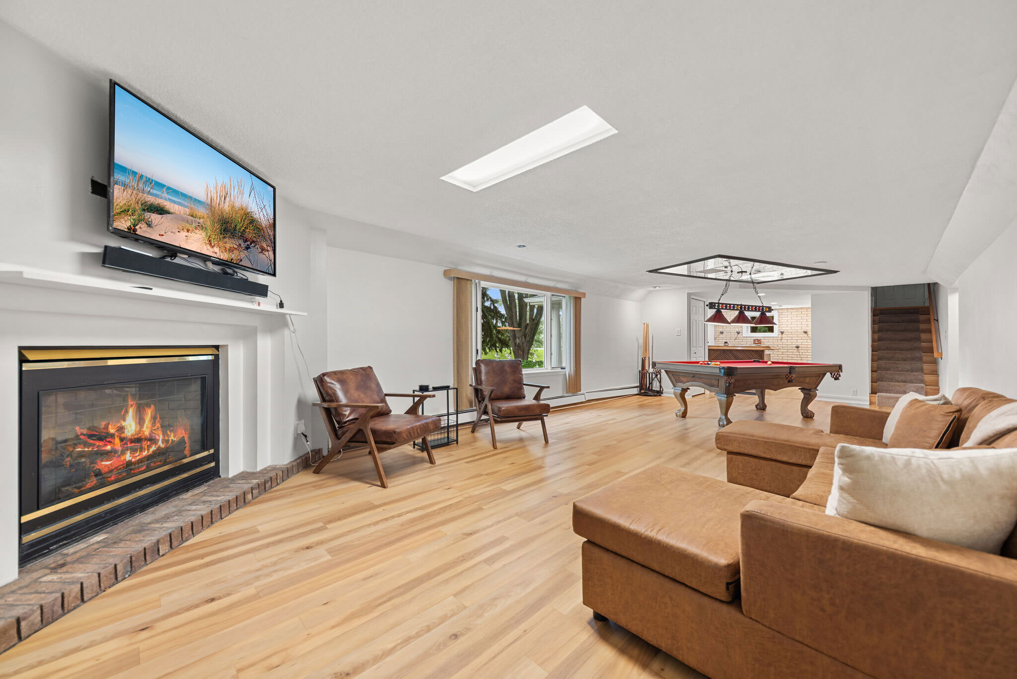 Lower level recreation room with billiards and a TV lounge for group fun.