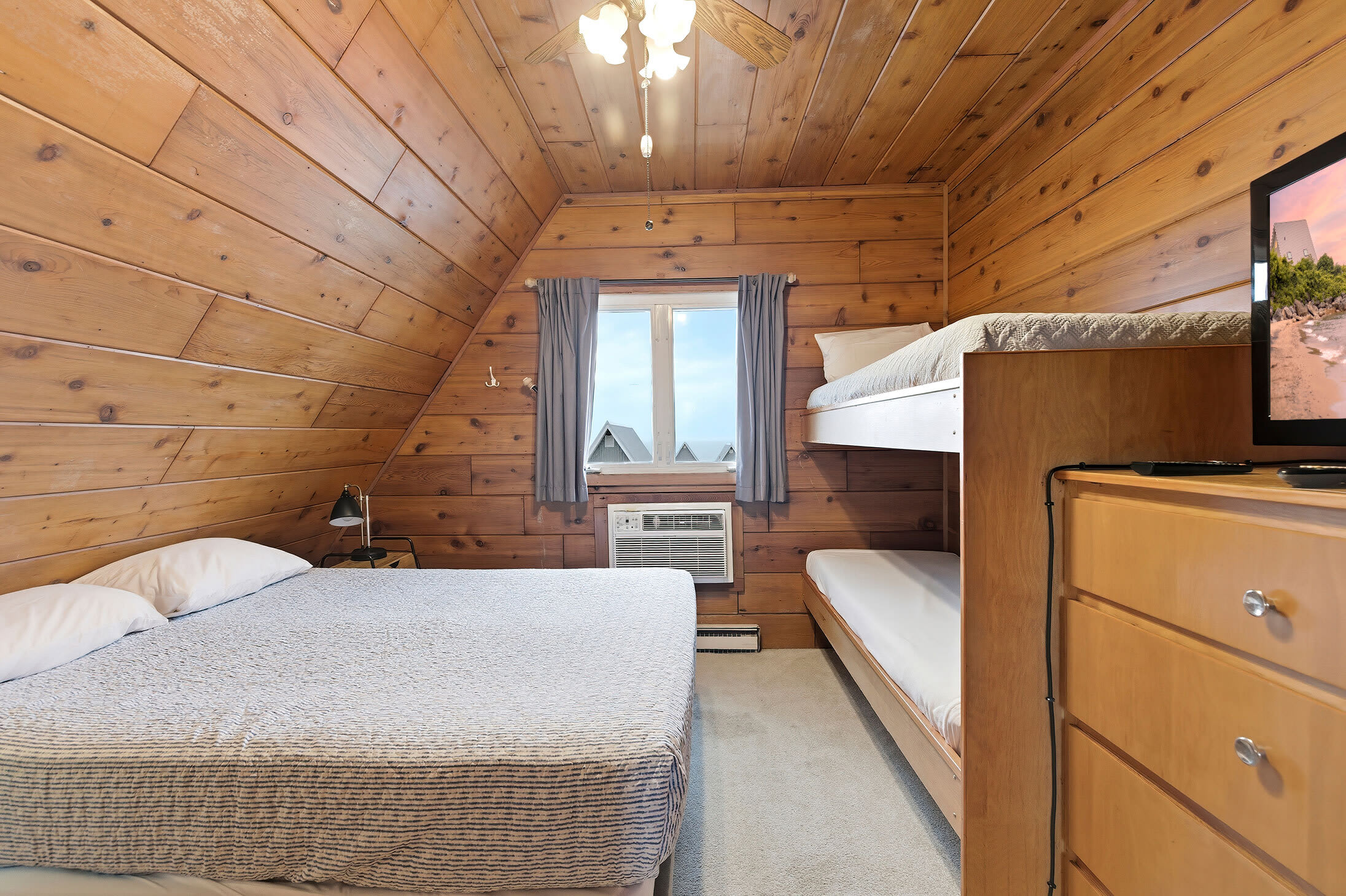 Warm walls, soft light, and a window worth waking up to.