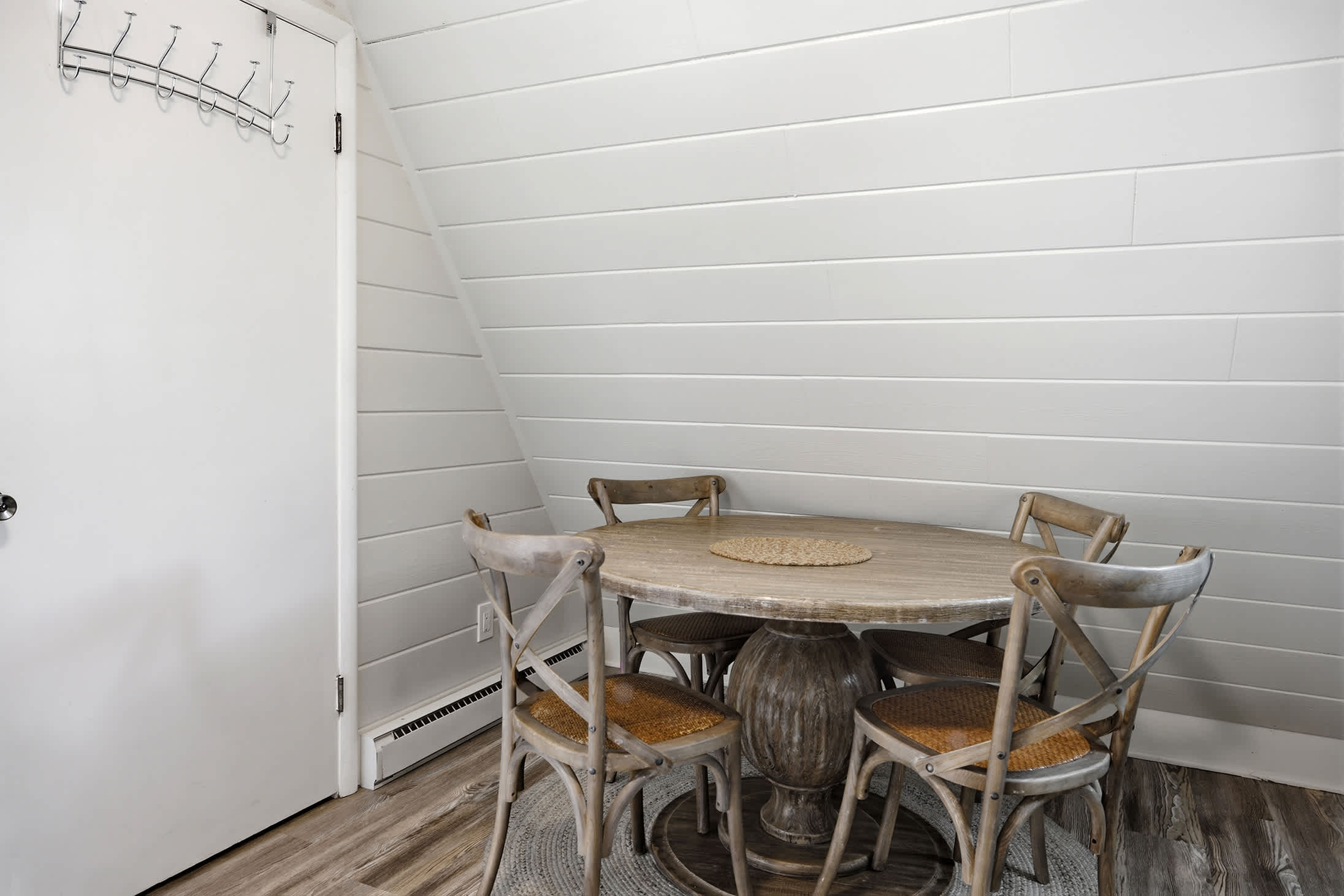 Located beside the kitchen, the dining area provides an easy space for shared meals.