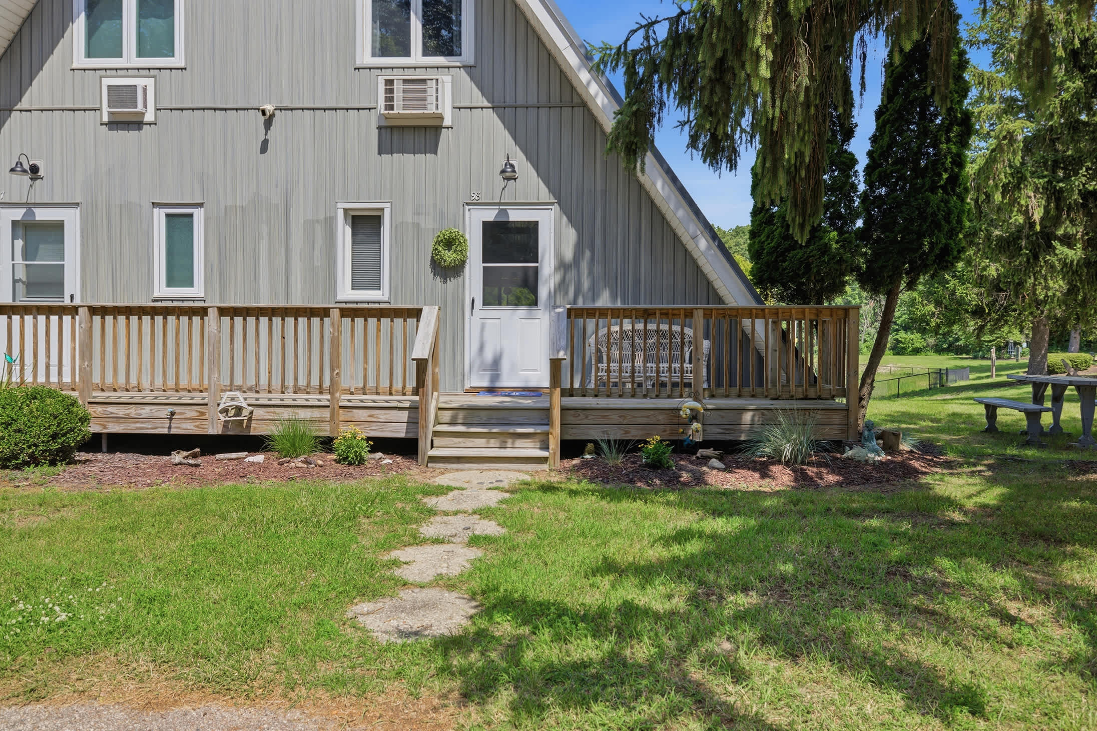 Chalet #98 welcomes you home, with the peaceful resort pond just steps away.