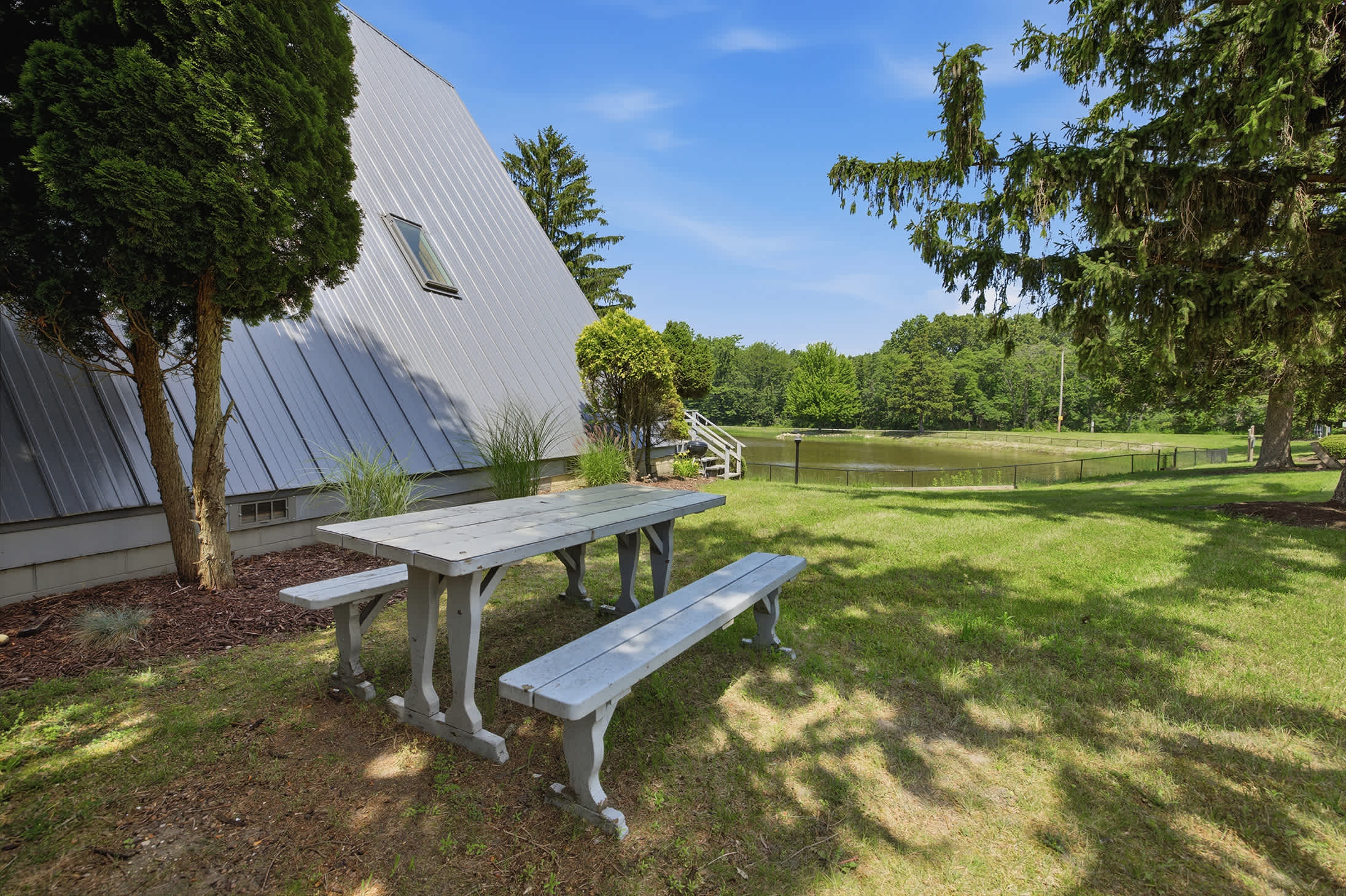 Enjoy extra outdoor space with a picnic table overlooking the tranquil resort pond.