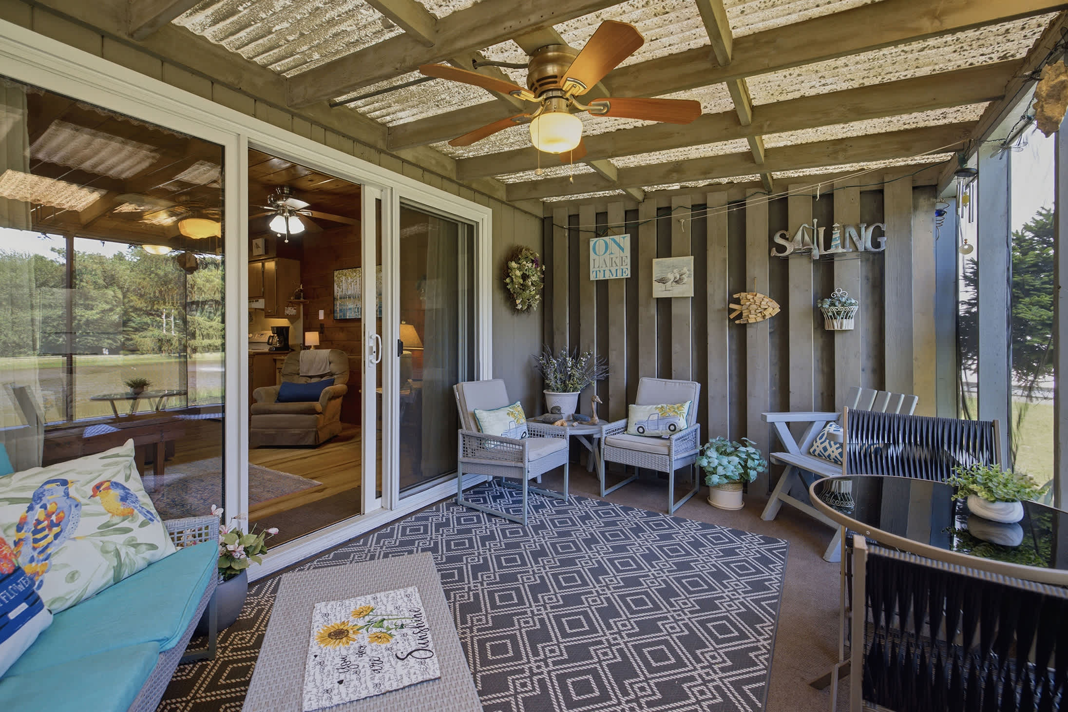 Relax on the screened porch with comfortable seating and calming pond views just outside.