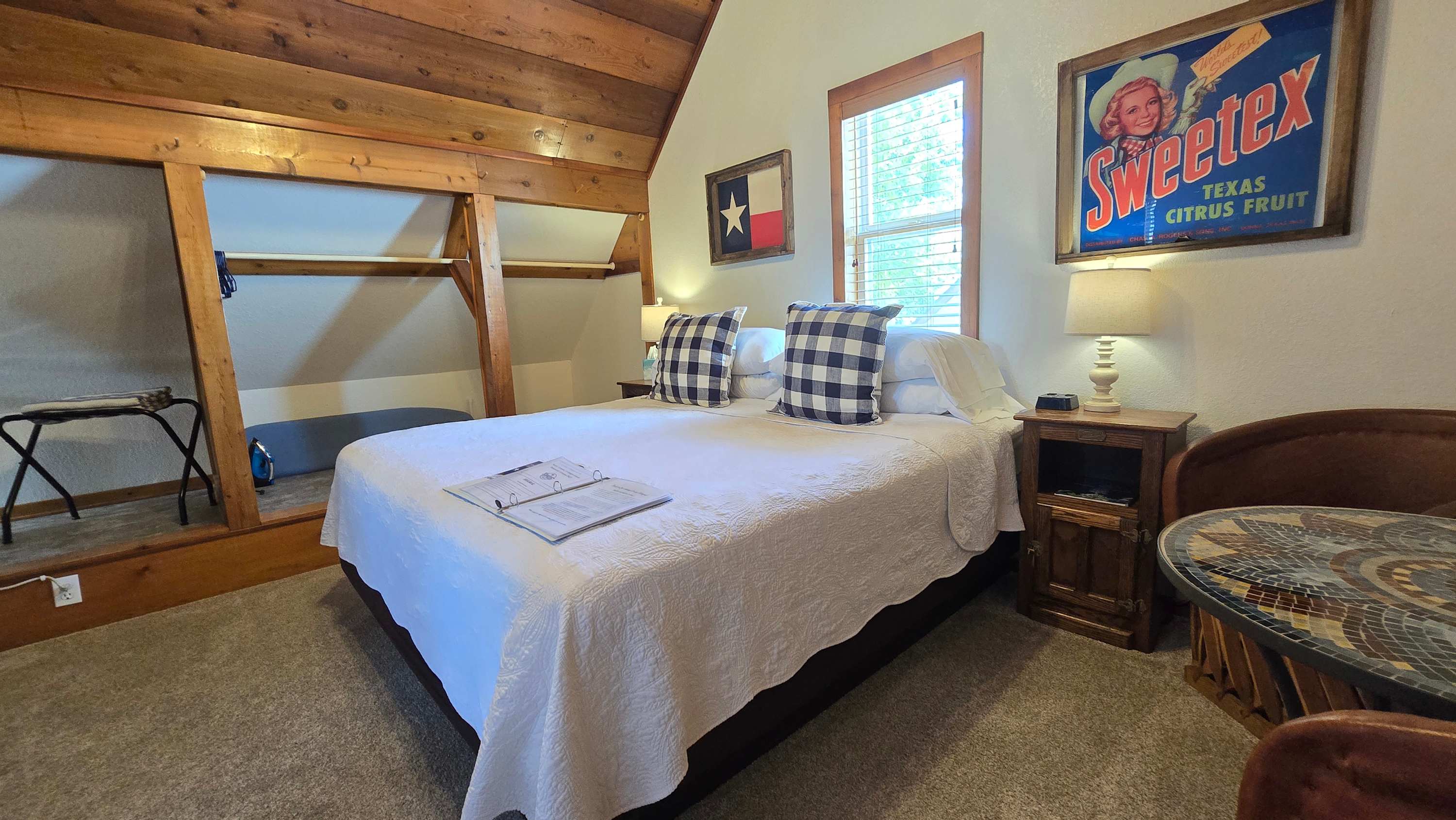 The second-floor studio boasts a king-sized bed, full bath, & kitchenette area​