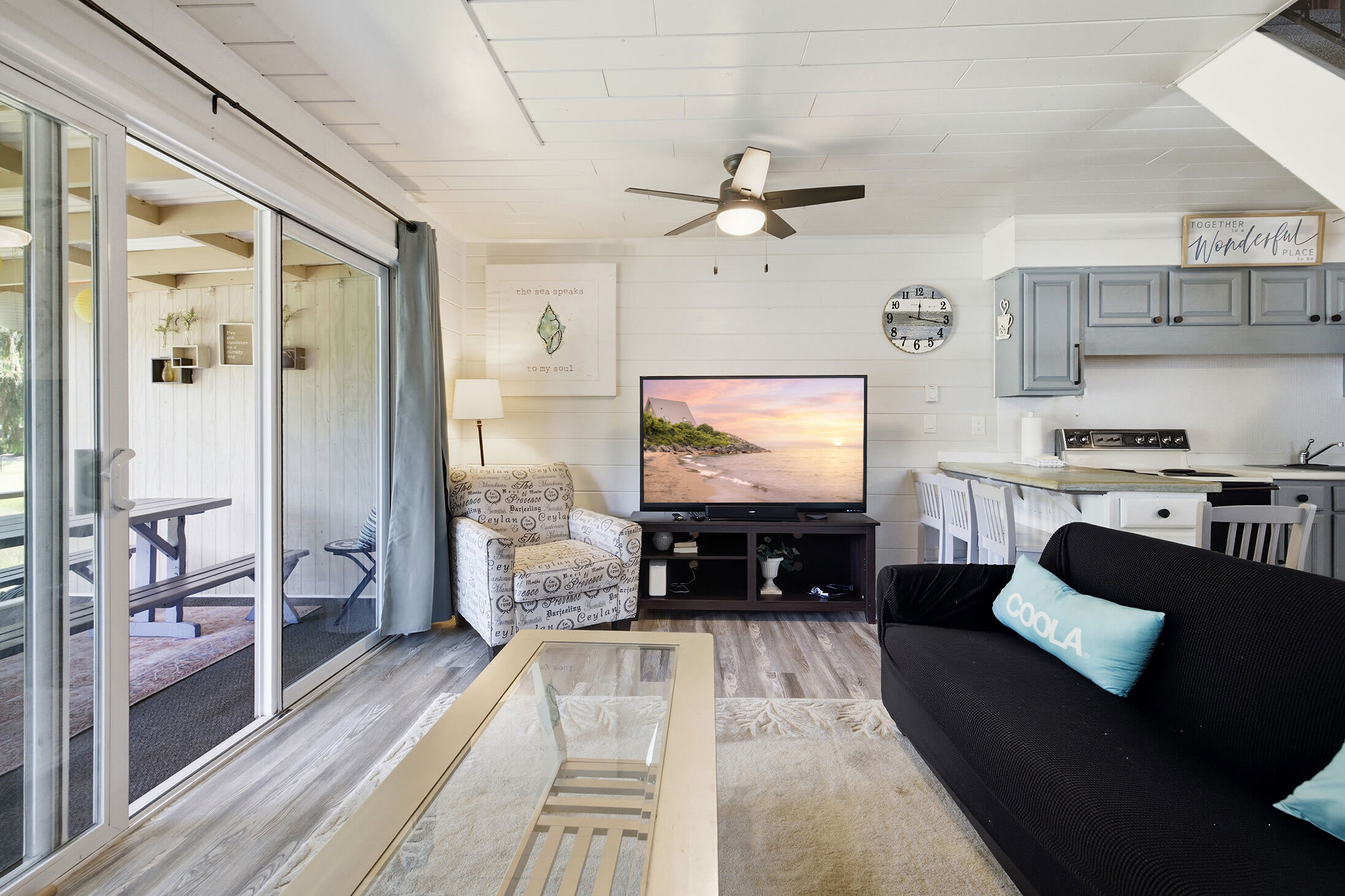 Move easily from the living room to the breakfast bar or screened porch throughout your stay.