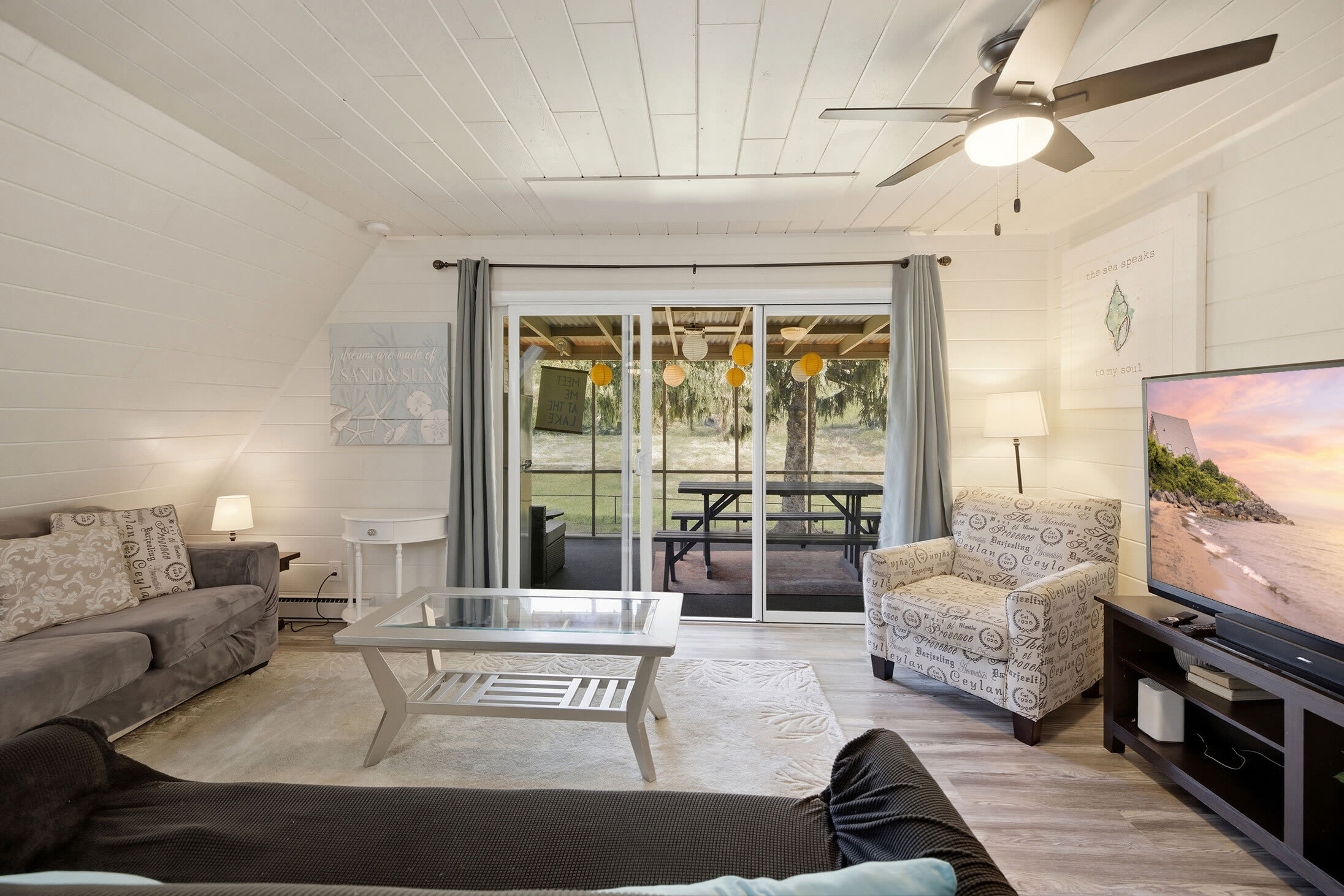 Stretch out in the living room, then head straight to the screened porch for fresh air and pond views.