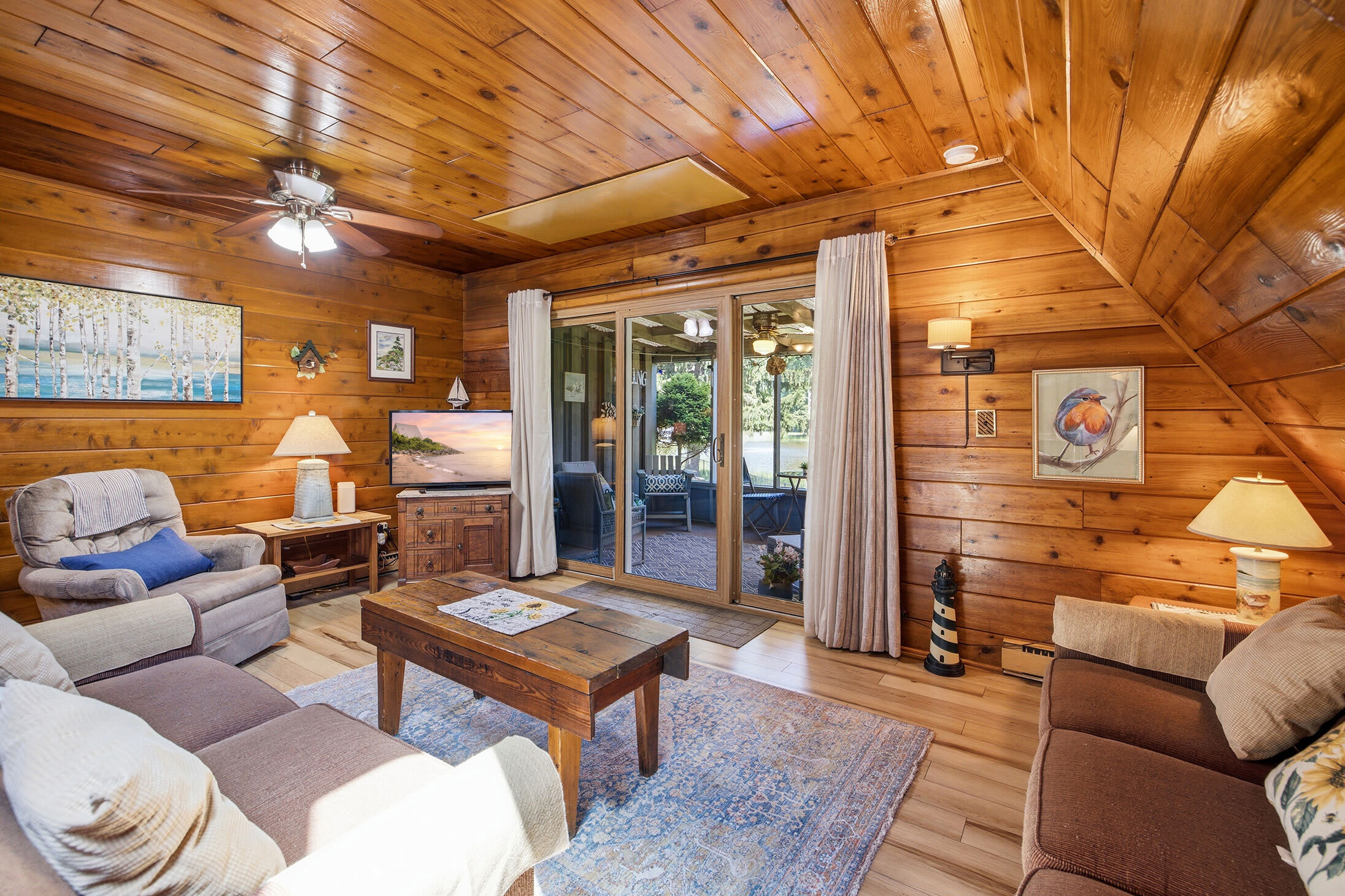 The main living room flows seamlessly onto the screened porch for more space to unwind.