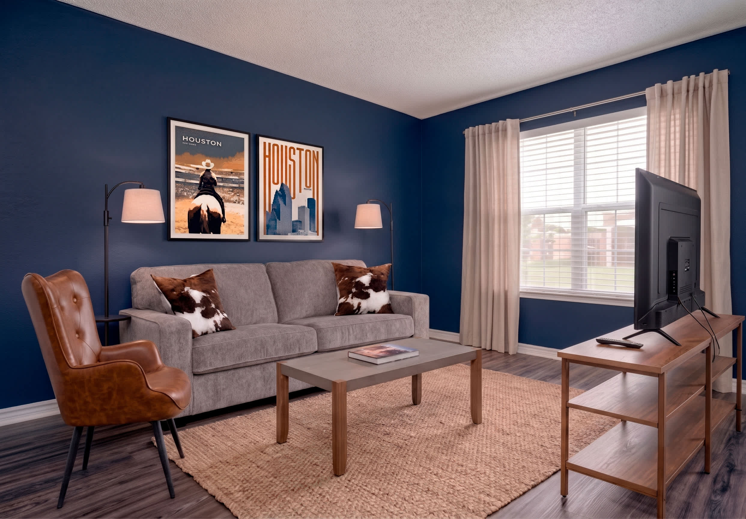 Experience Houston charm in this stylish living room with cozy seating and vibrant decor.