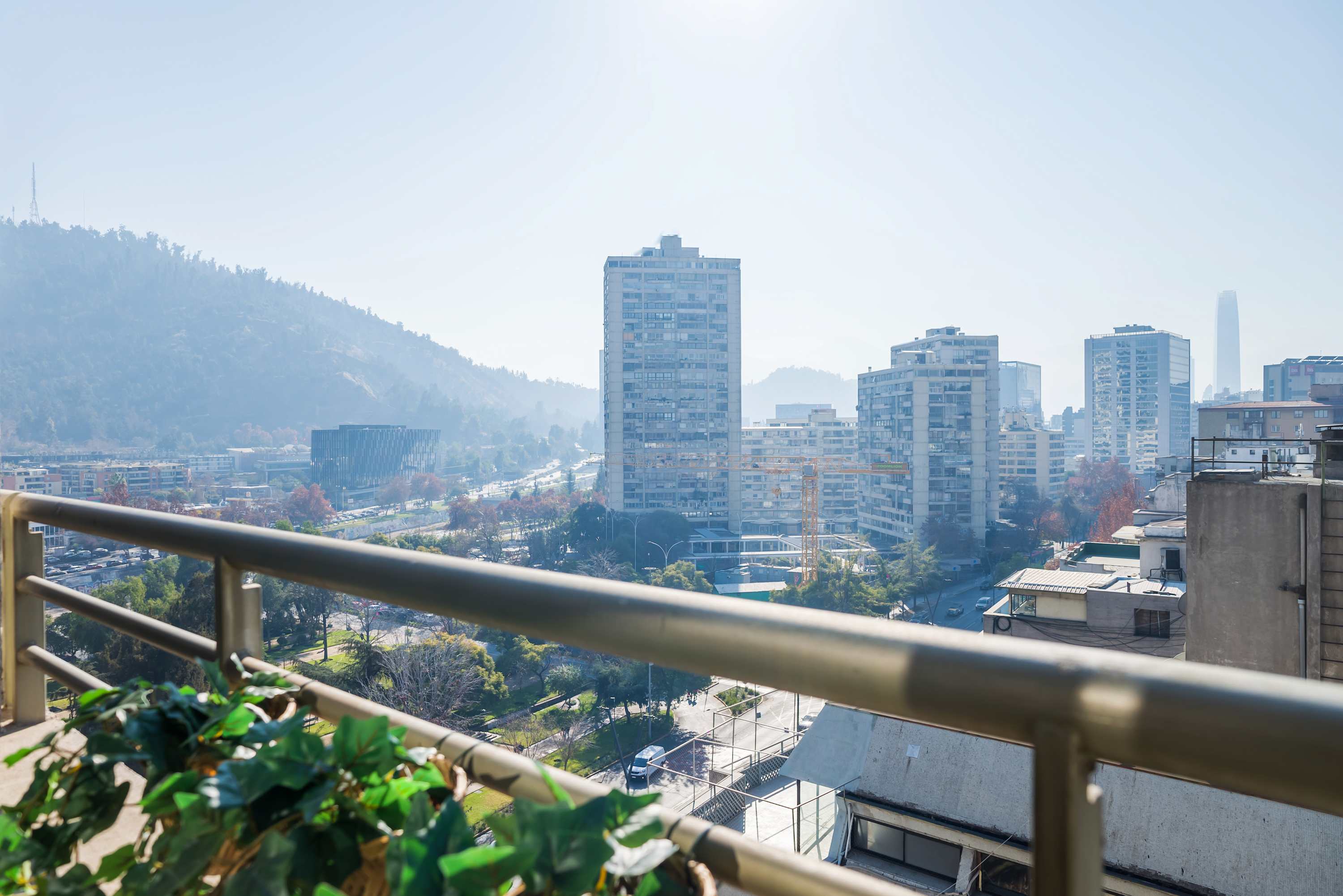 Enjoy stunning city and mountain views from your private balcony, perfect for relaxing after a day of exploring Santiago.