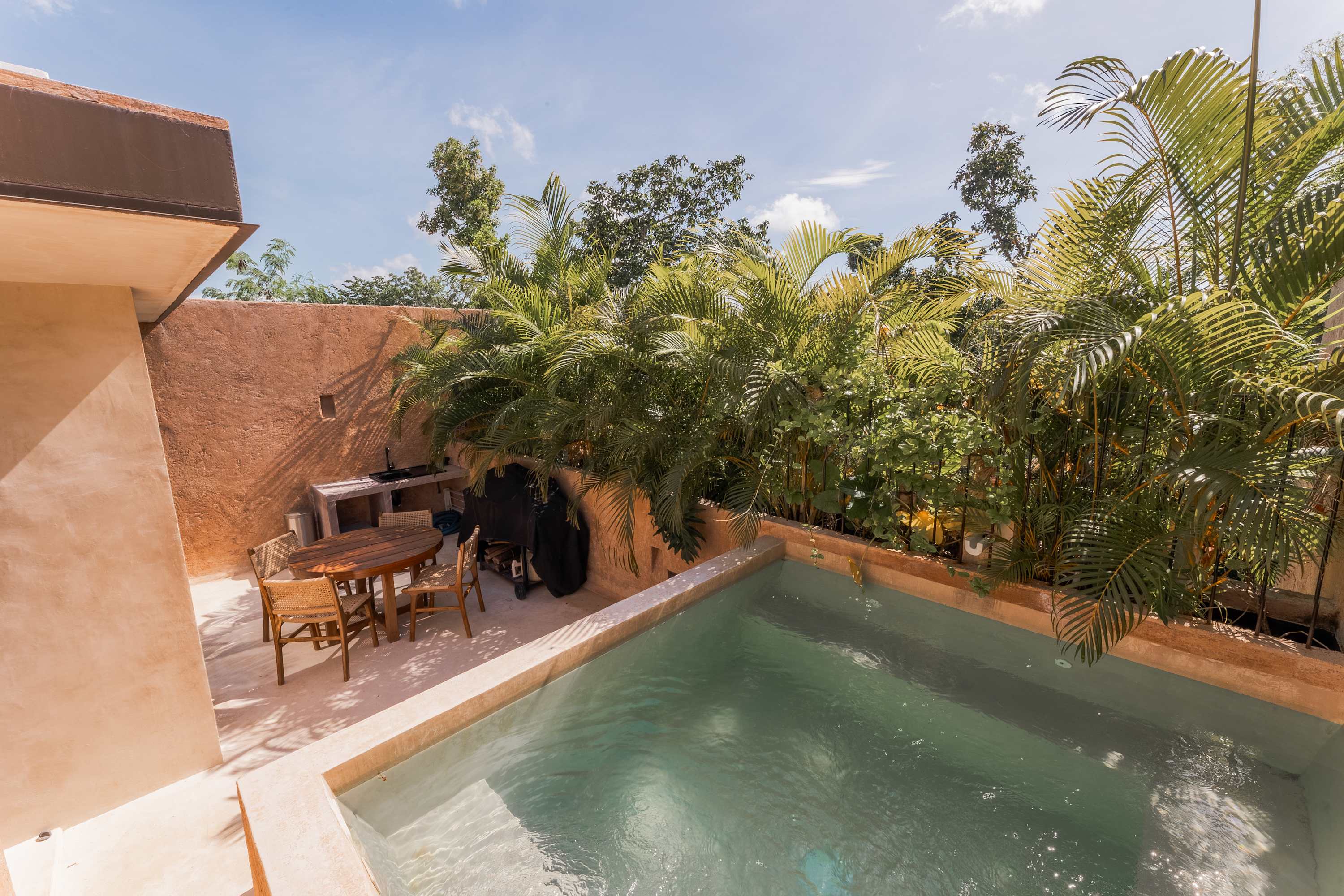 Enjoy the Tulum breeze from your private rooftop, ideal for lounging, grilling, and outdoor meals. + Plunge pool