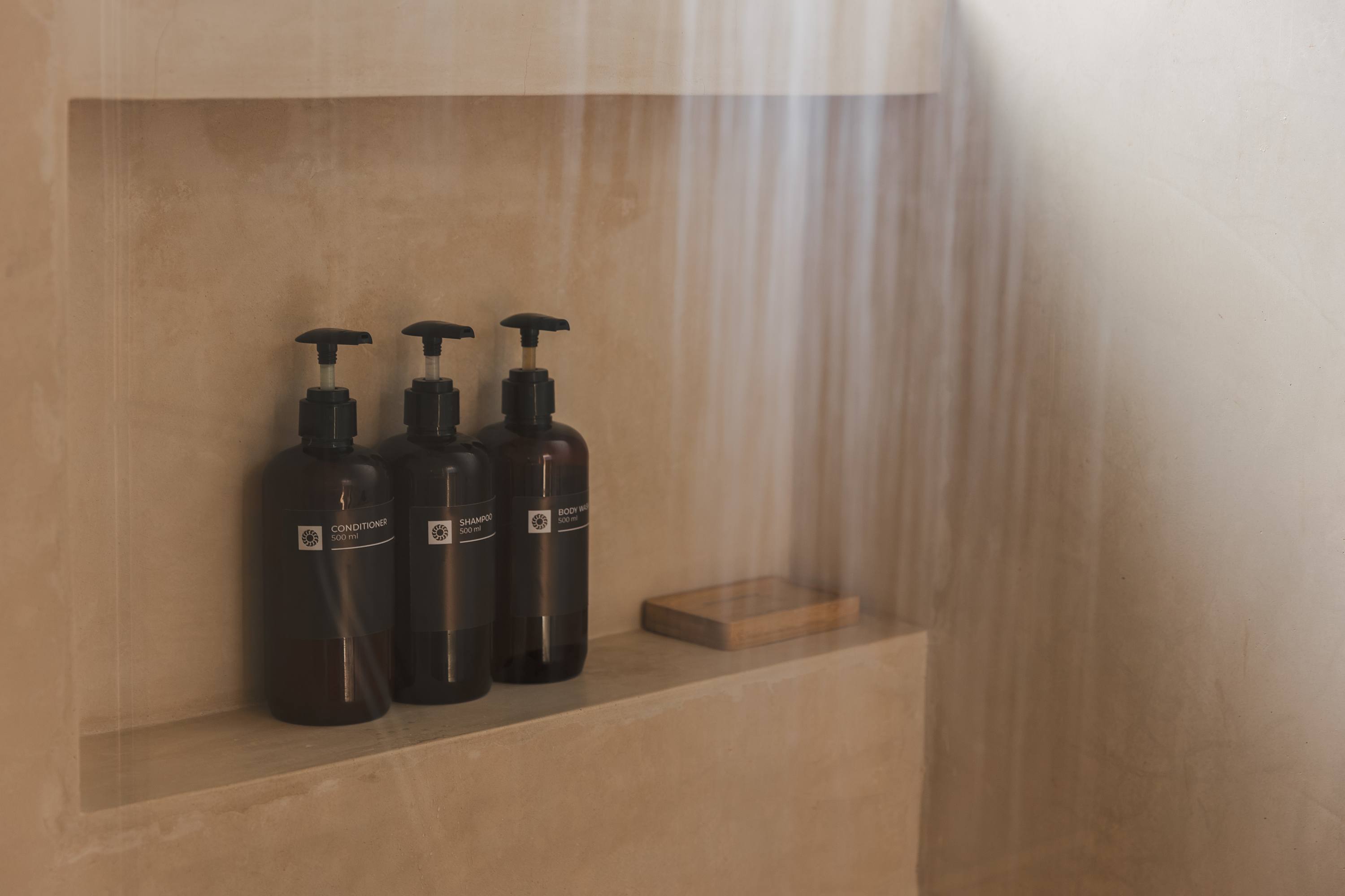 Modern bathroom with complimentary amenities provided for every stay.