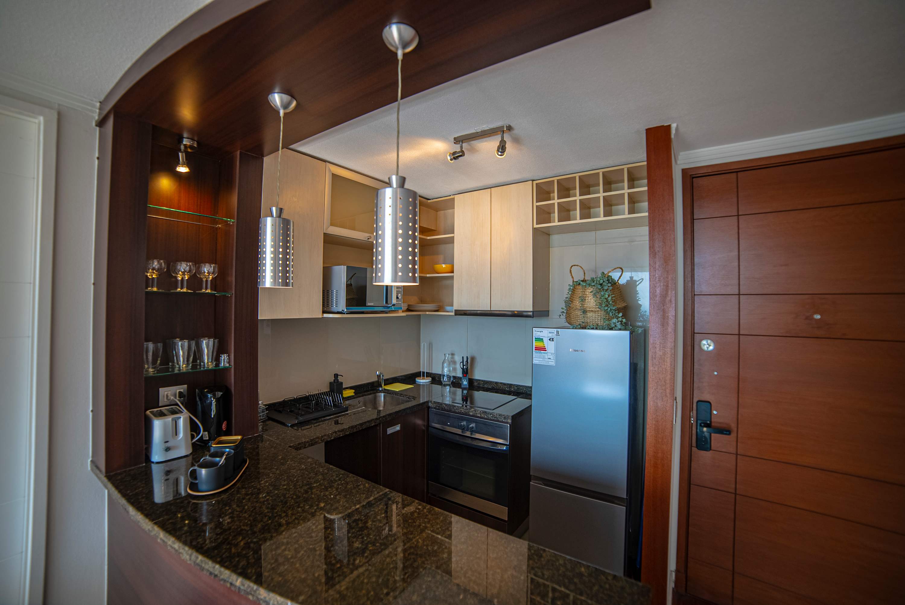 Modern kitchen with sleek granite countertops and stainless steel appliances, perfect for cooking your favorite meals.