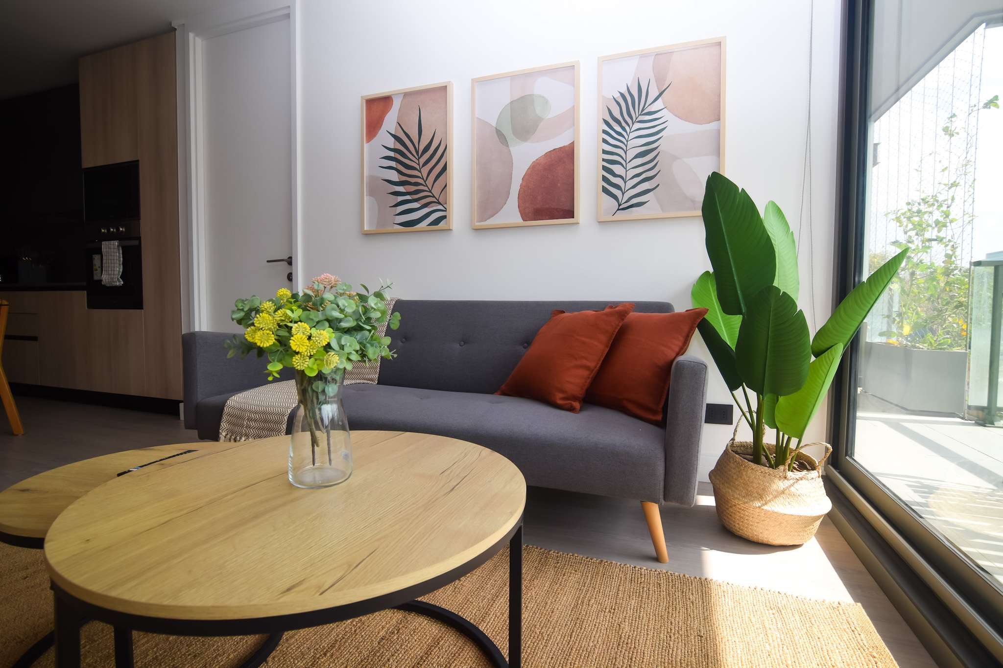 Bright and stylish living area with modern decor and natural light, perfect for relaxation.