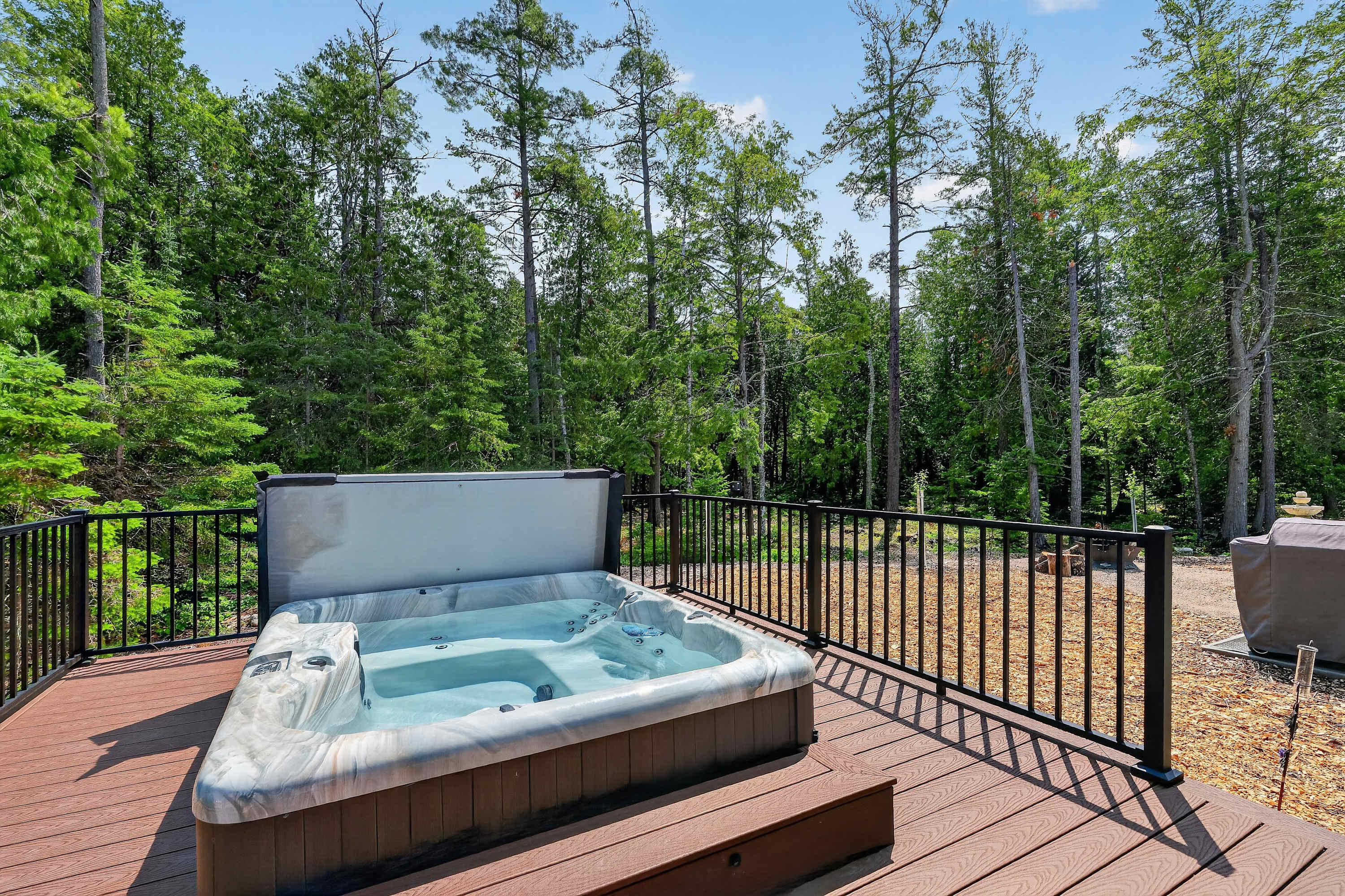 Additionally a large deck with seating and hot tub!