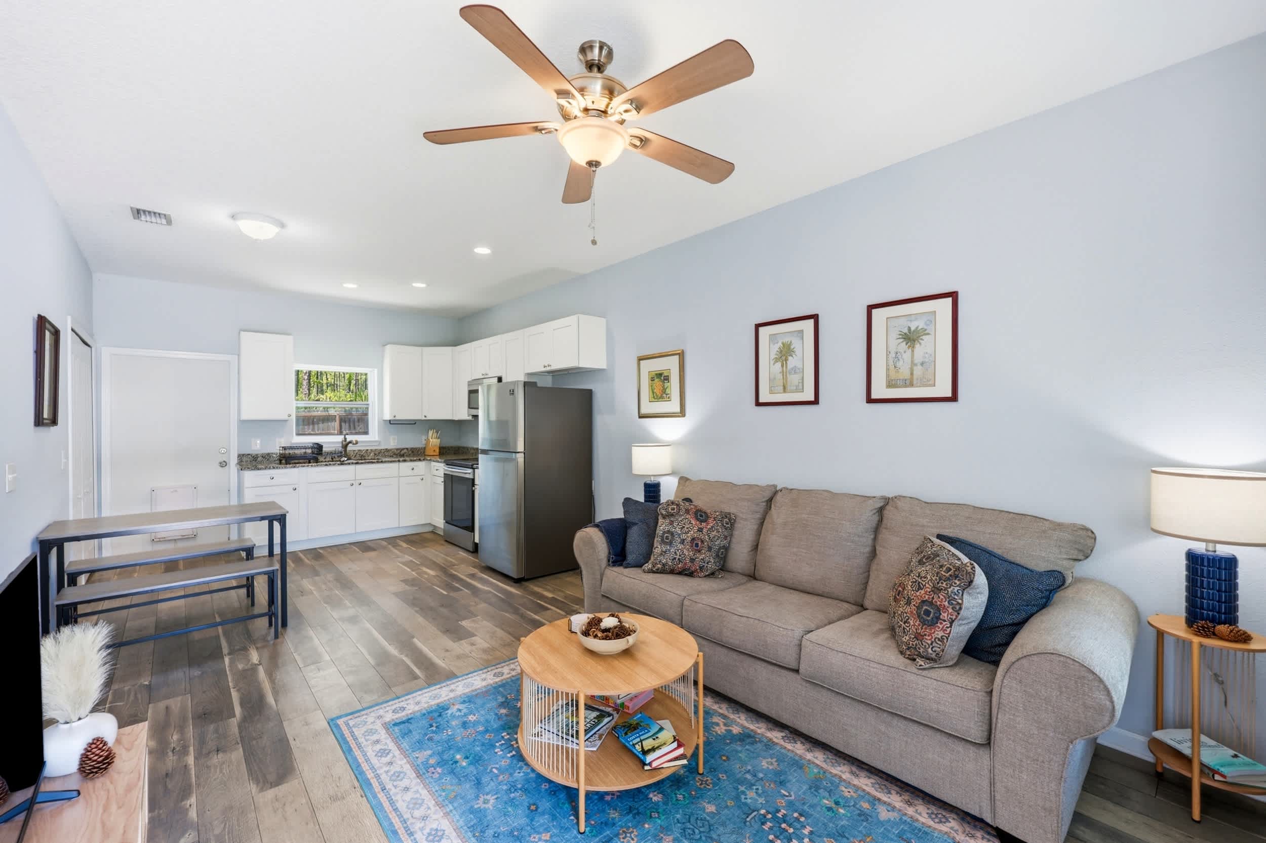 A bright, comfortable gathering space with a Smart TV and sofa sleeper
