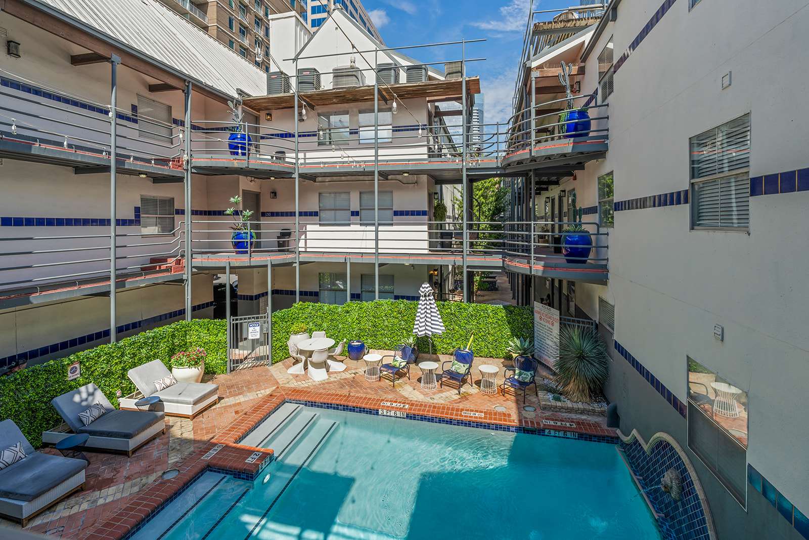 Relax by the pool in this charming courtyard oasis, perfect for unwinding after a day of exploring the city.