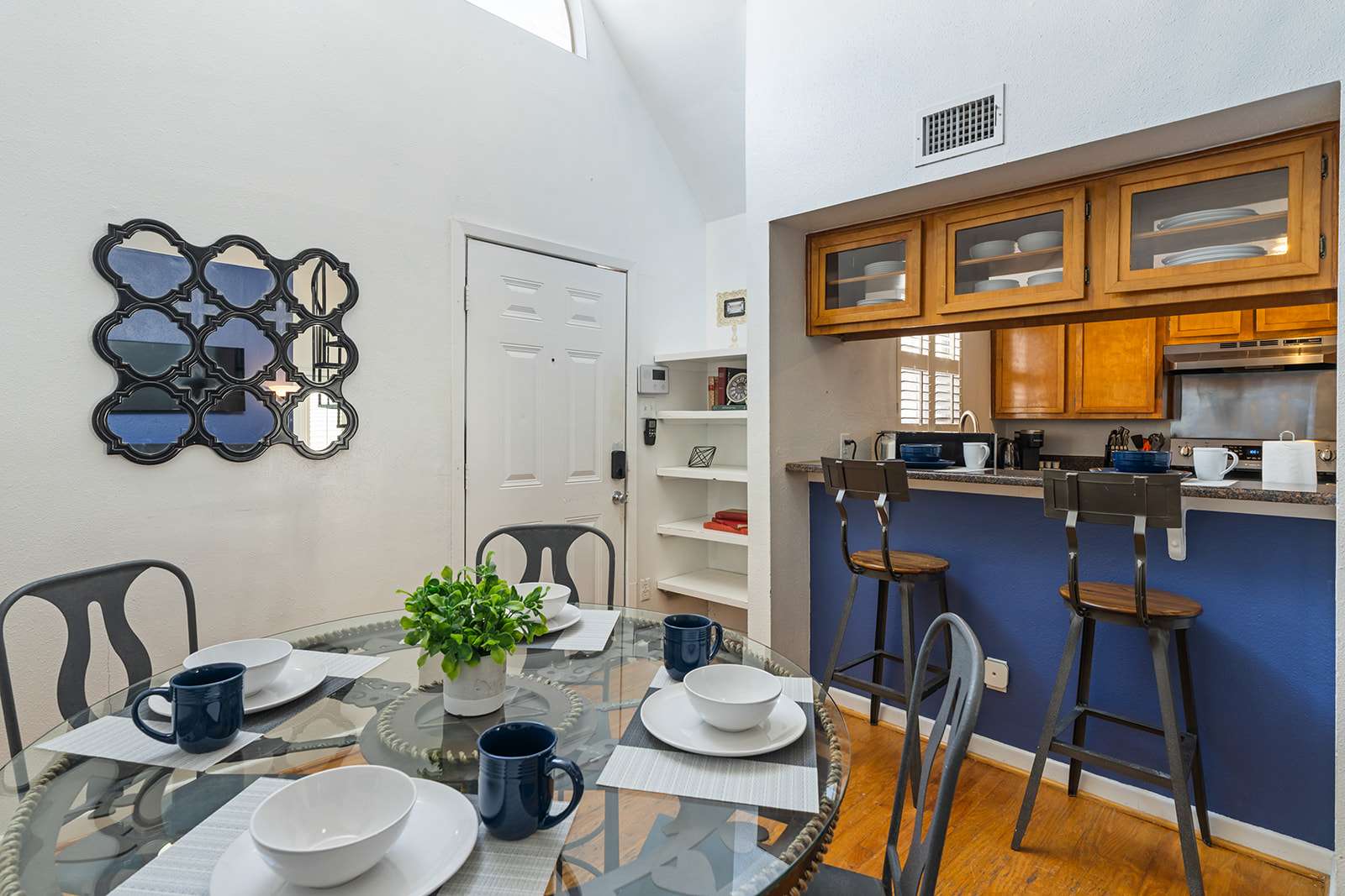 Cozy dining area with stylish decor and convenient kitchen access, perfect for family meals.
