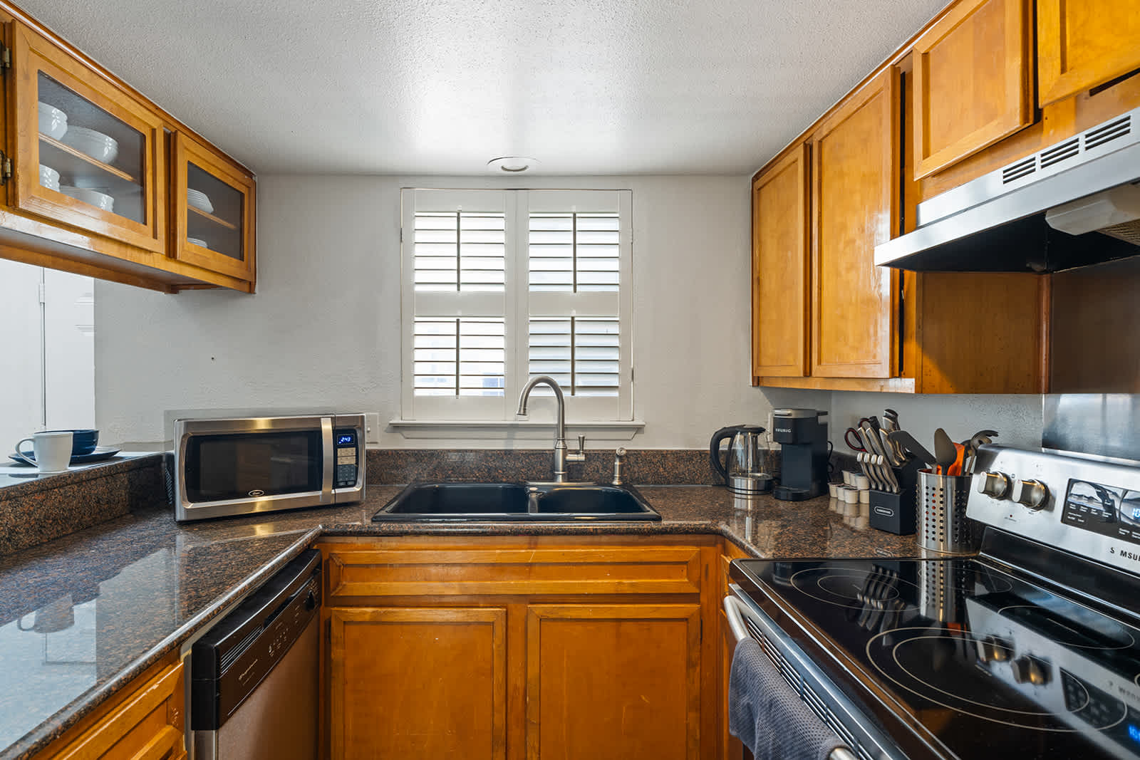Modern kitchen with sleek appliances and ample counter space, perfect for preparing family meals.