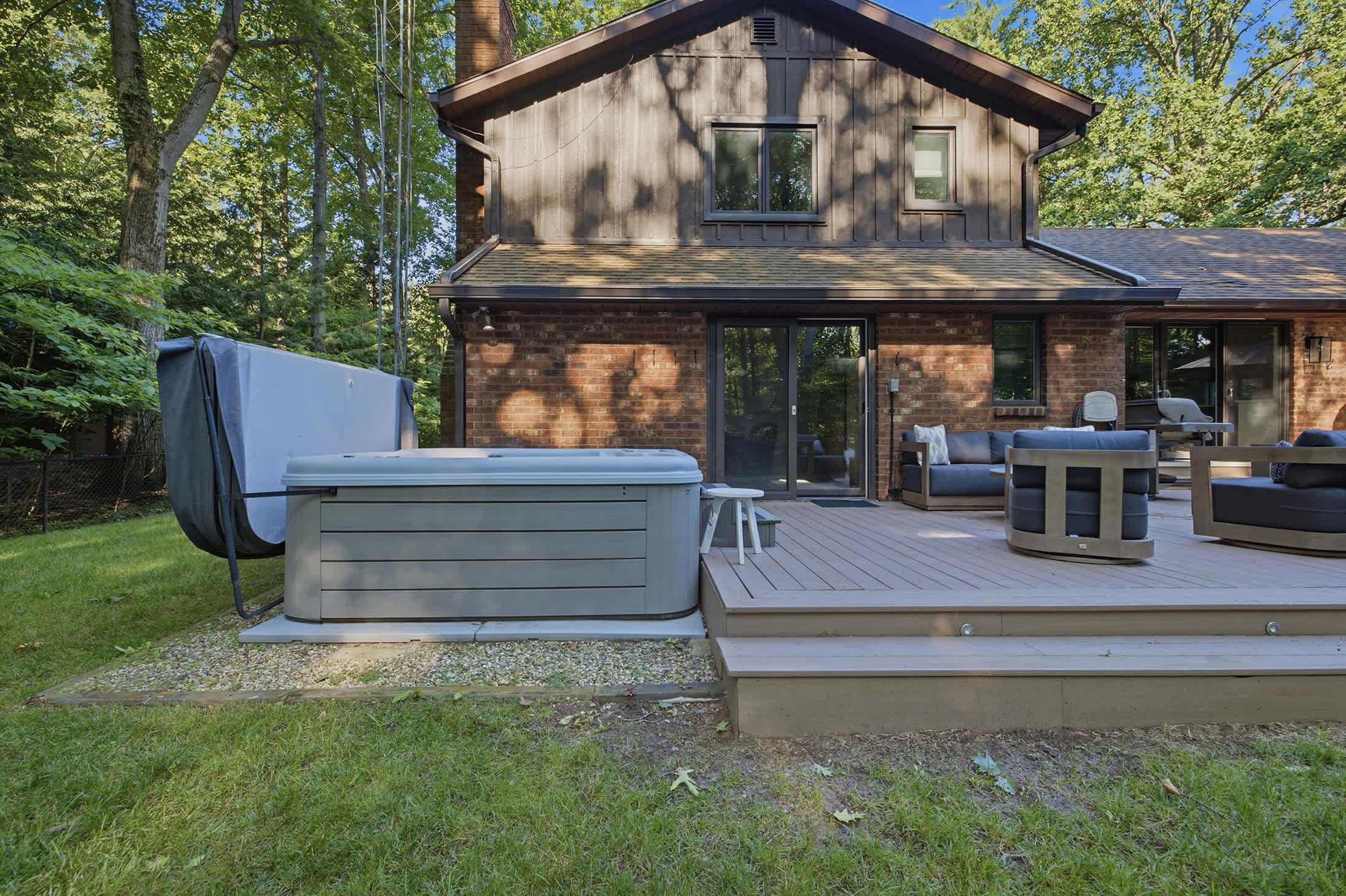 Expansive deck with outdoor dining and a hot tub for year round relaxation.